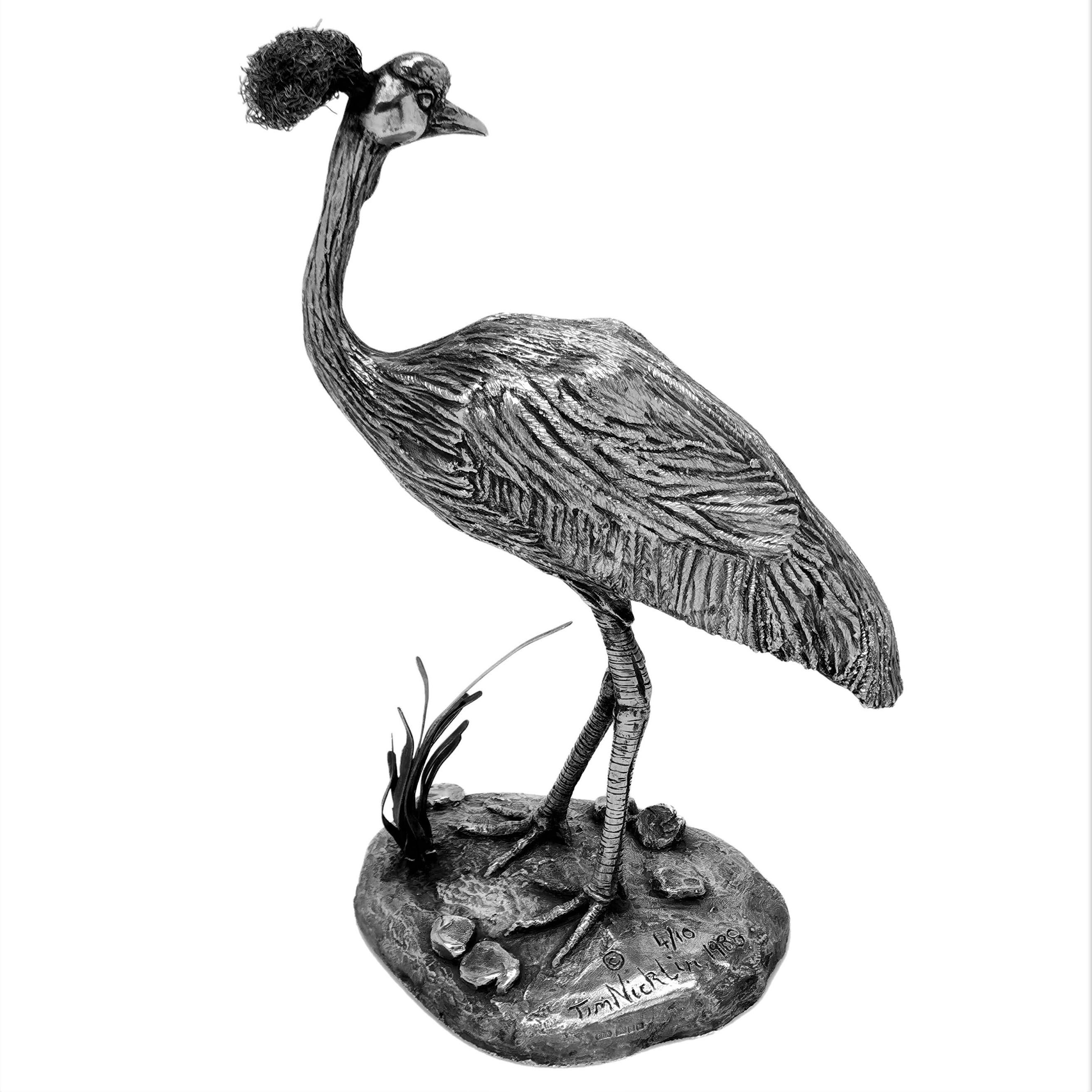 An impressive sterling silver model of an African crowned crane by Kenyan Sculptor Tim Nicklin.

The Model was sculpted by Tim Nicklin in 1988 and Hallmarked in London in 1990. The crane is edition 4 of 10.

Measures: Weight - 1868g /