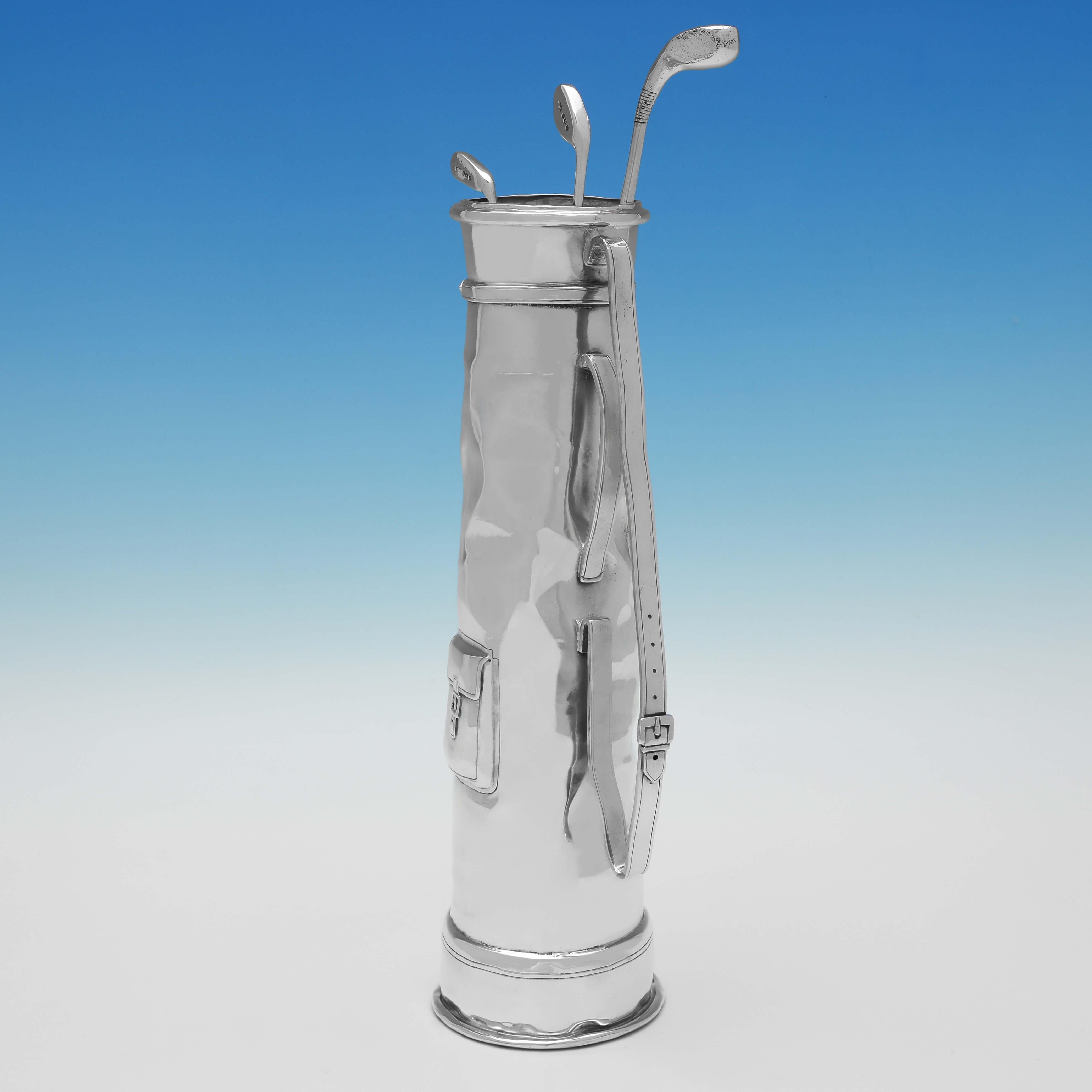 Hallmarked in Birmingham in 1926 by Thomas Fattorini, this very stylish golf trophy takes the form of a Sterling Silver Golf Bag & 3 Golf Clubs, which have been realistically modelled. The golf bag measures 10.5