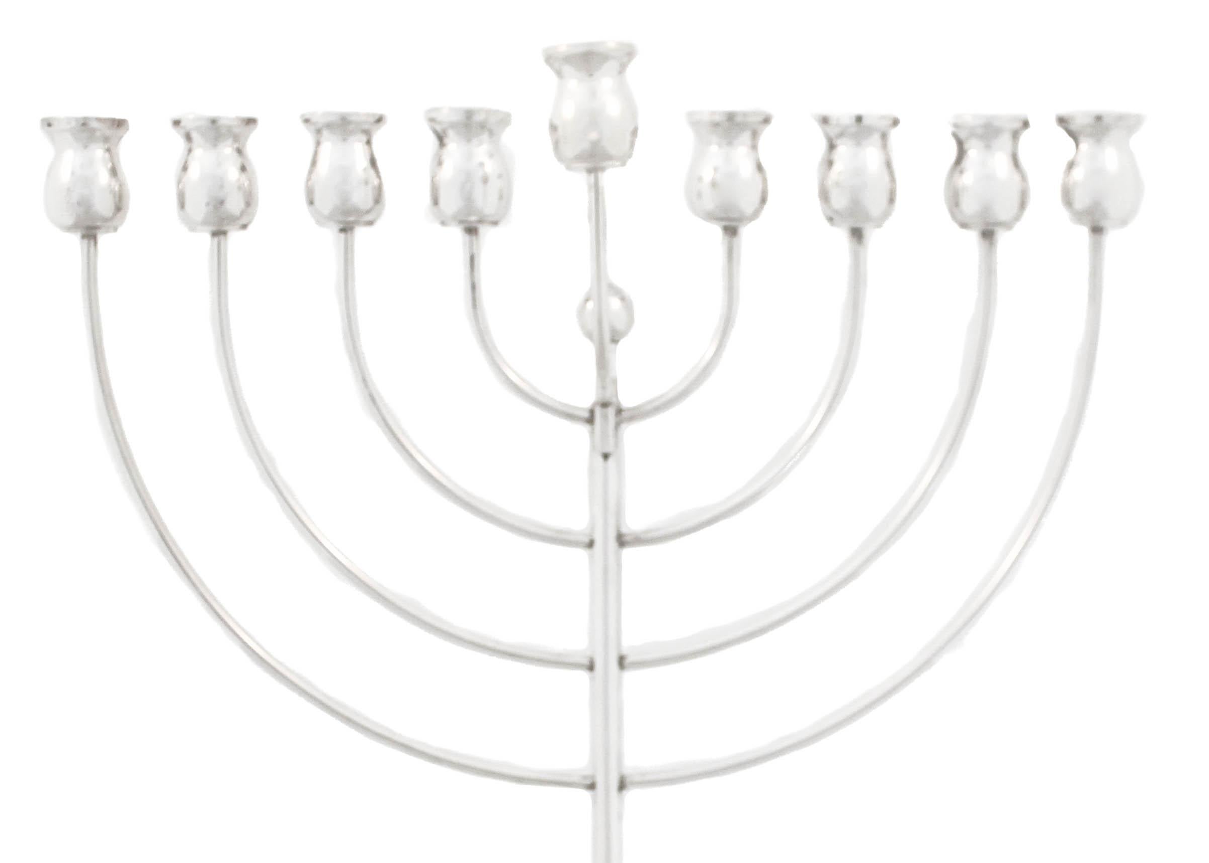 Being offered is a sterling silver menorah made in Italy.  It is sleek and modern without any ornamentation.  A young and contemporary style and design for an ancient tradition.  Bring in the holiday in style with this sterling silver menorah.