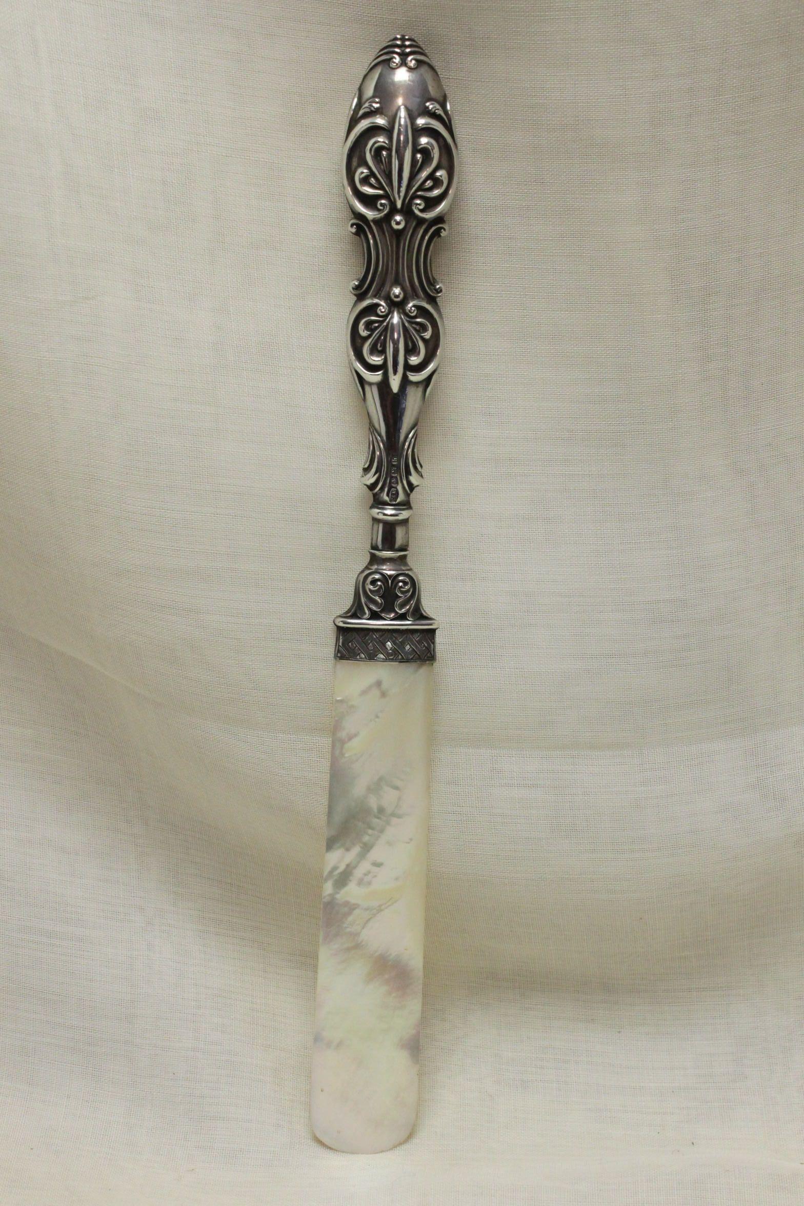 This sterling silver handled paper knife features a blade of Mother-of-pearl of lovely colour and figure, and is a rare survivor. Due to the fragility of the blade, these are obviously much rarer than those with more durable blades. Made in