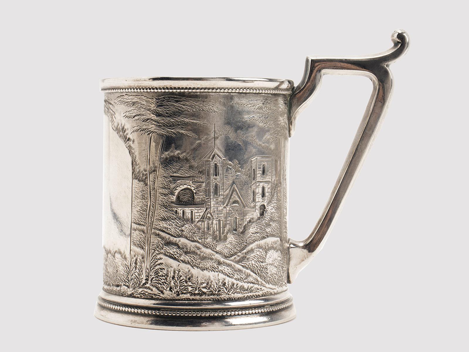 Sterling silver 925/1000 mug, lost wax worked and engraved, depicting the architecture of a village. C.G. Halberg, Stockholm, Sweden 1910.