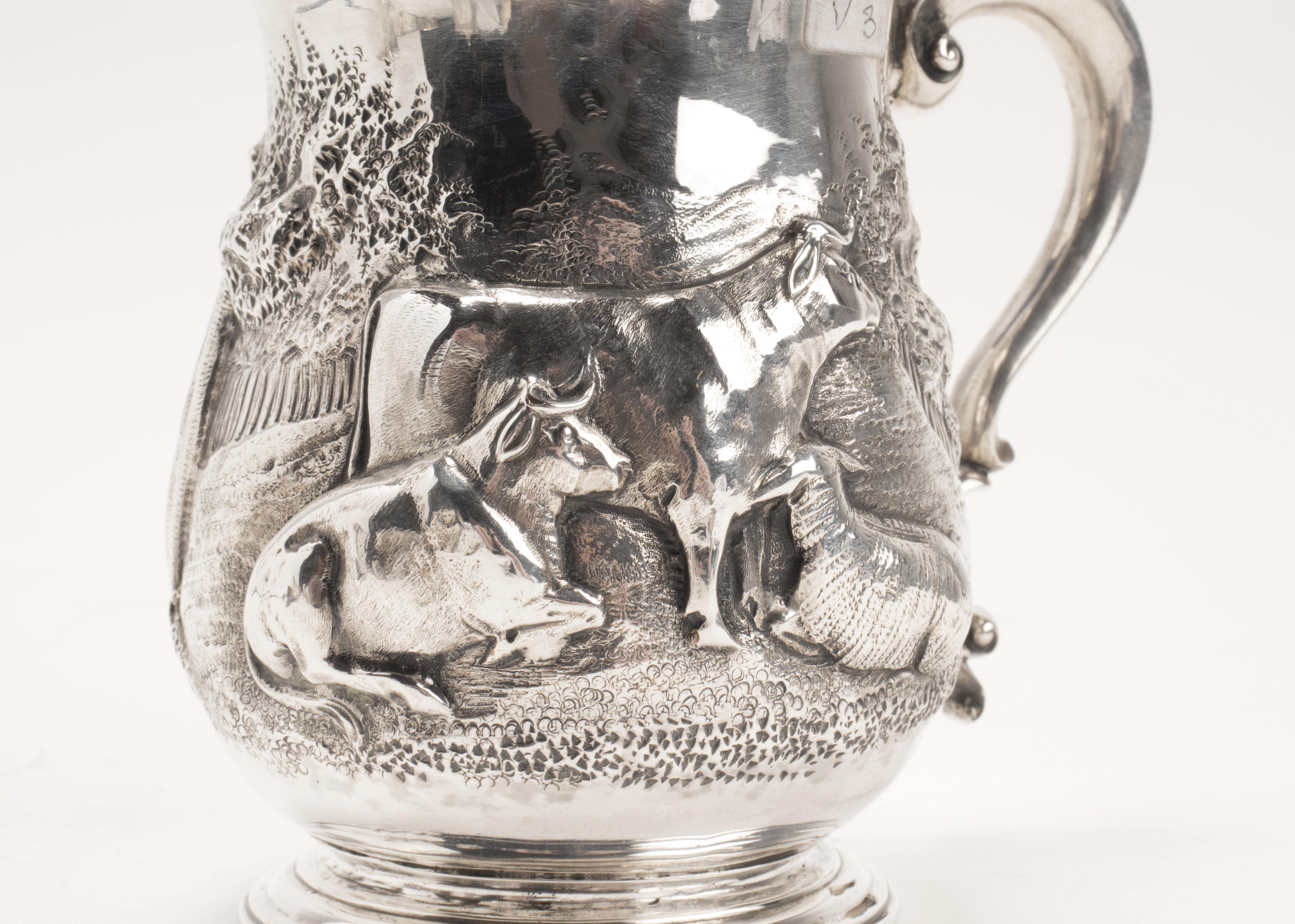 Sterling silver 925/1000 mug, embossed, depicting grazing cows. Henry Holland sr. Victoria’s head hallmark, London, 1856.
