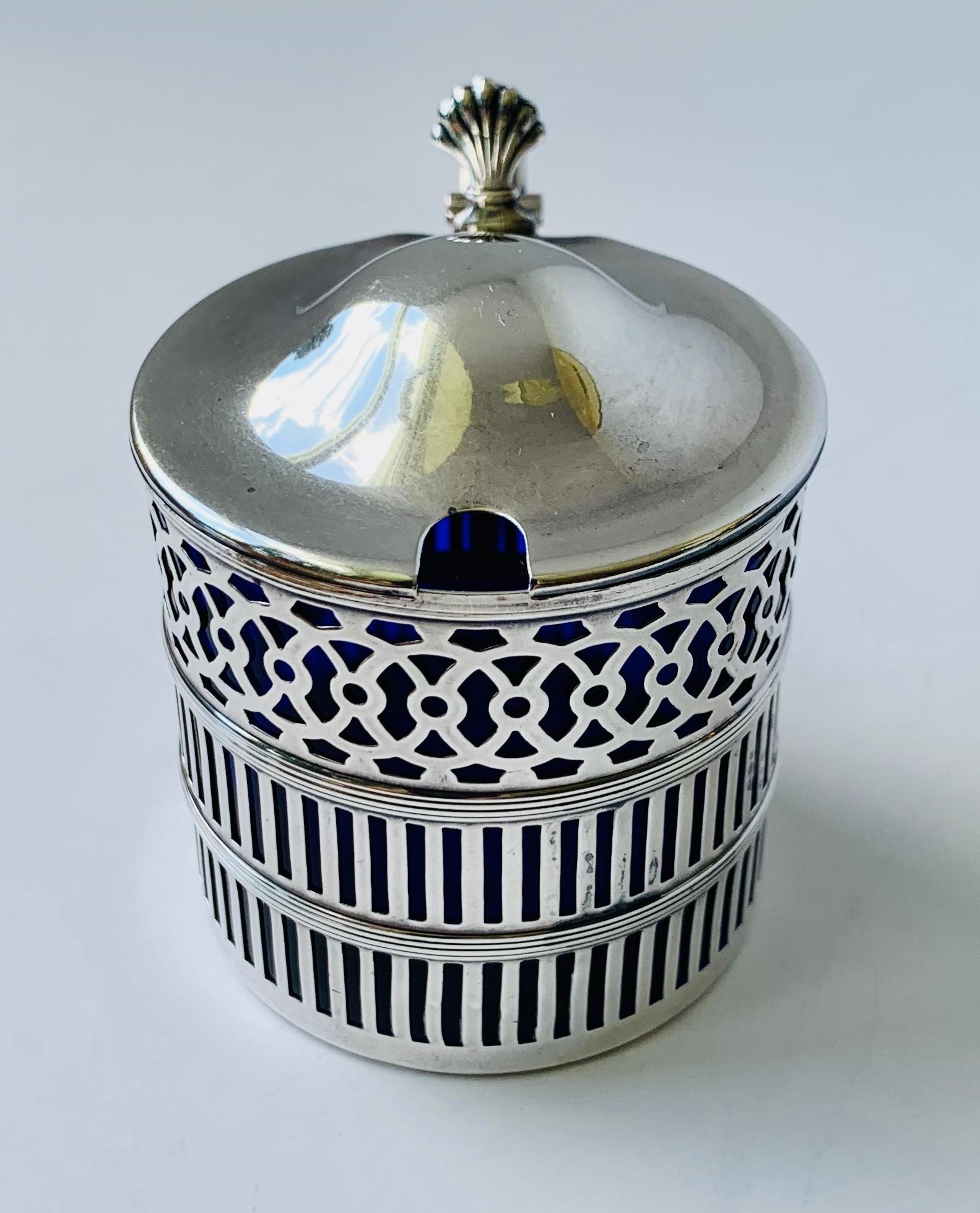 This handsome sterling silver mustard pot is by Webster Company. They were founded in 1894 in North Attleboro, Massachusetts. This sturdy pot has a beautiful cobalt blue glass liner which is removable for cleaning. This piece remains in very good