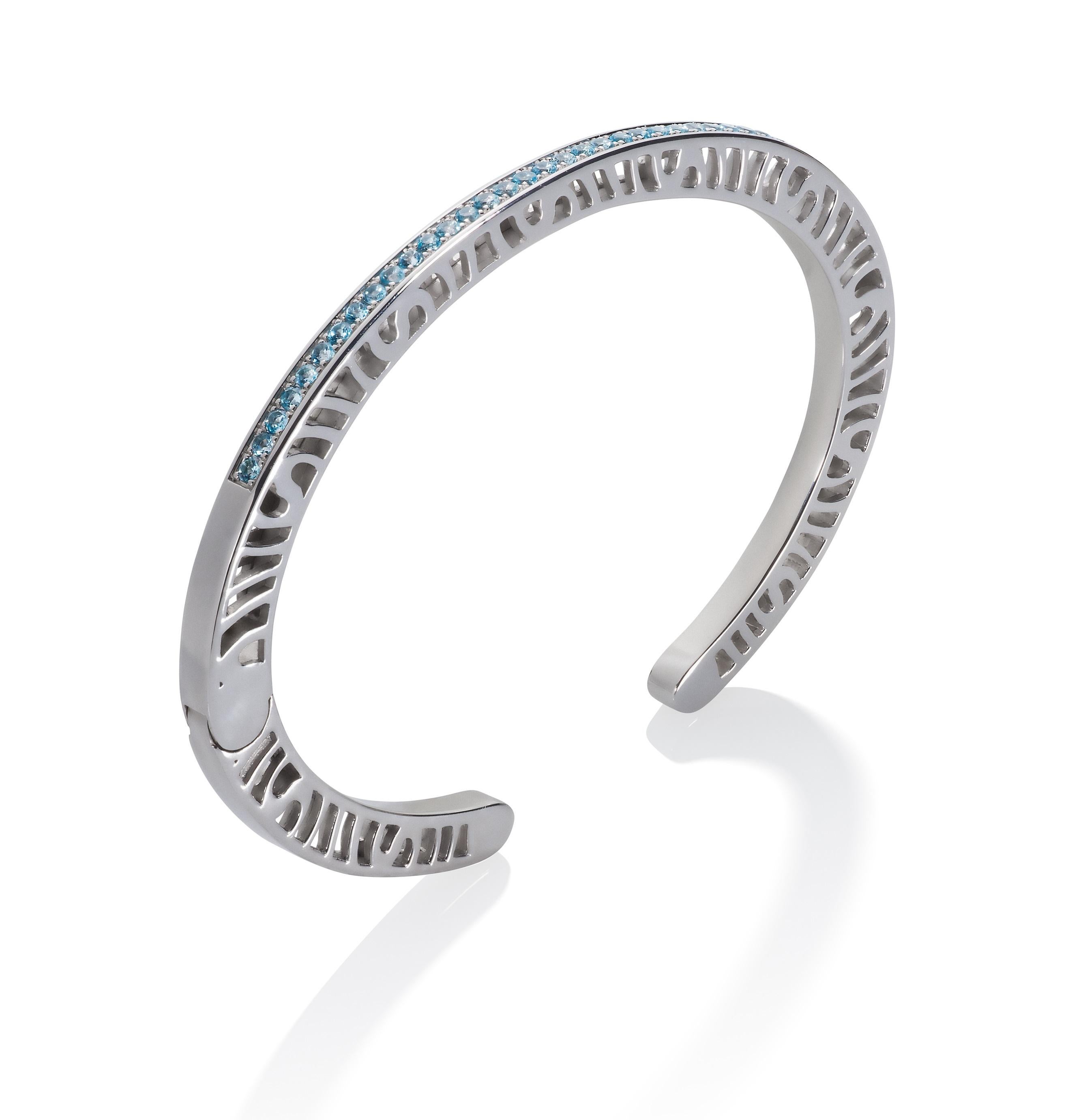 The slim and elegant 3mm  Shooting Stars cuff with 33 gemstones along the top and pierced sides is simple, classy and contemporary. The sides have a high polish and are pierced with the interlocking spirals which are a special signature design.