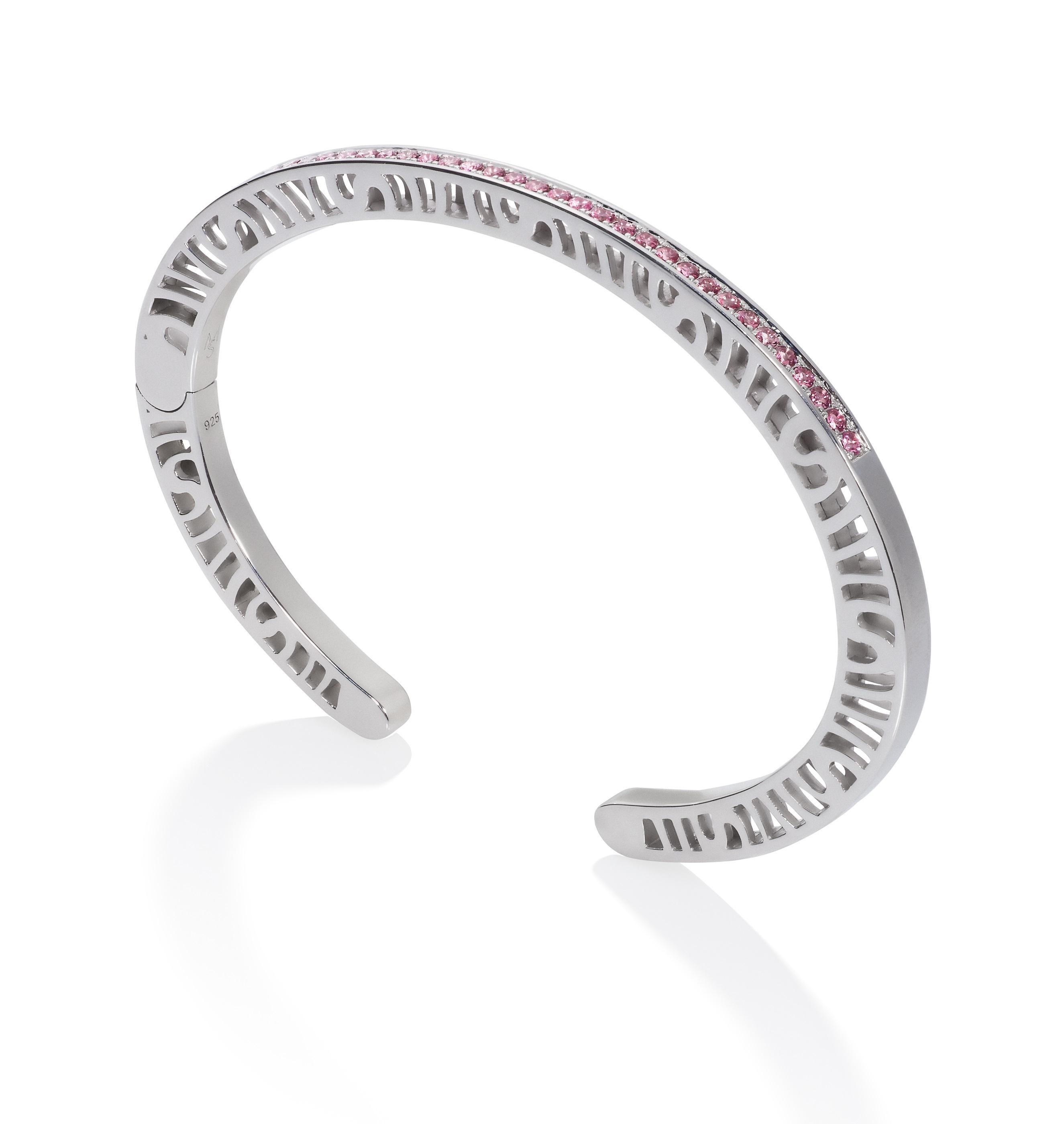 The contemporary 3mm cuff from the Shooting Stars Collection is made with 33 mixed color gemstones on the top (1.55 mm each).  Total carat weight is 0.69 cts. The sides have a high polish to an almost mirror finish and are pierced with the Shooting
