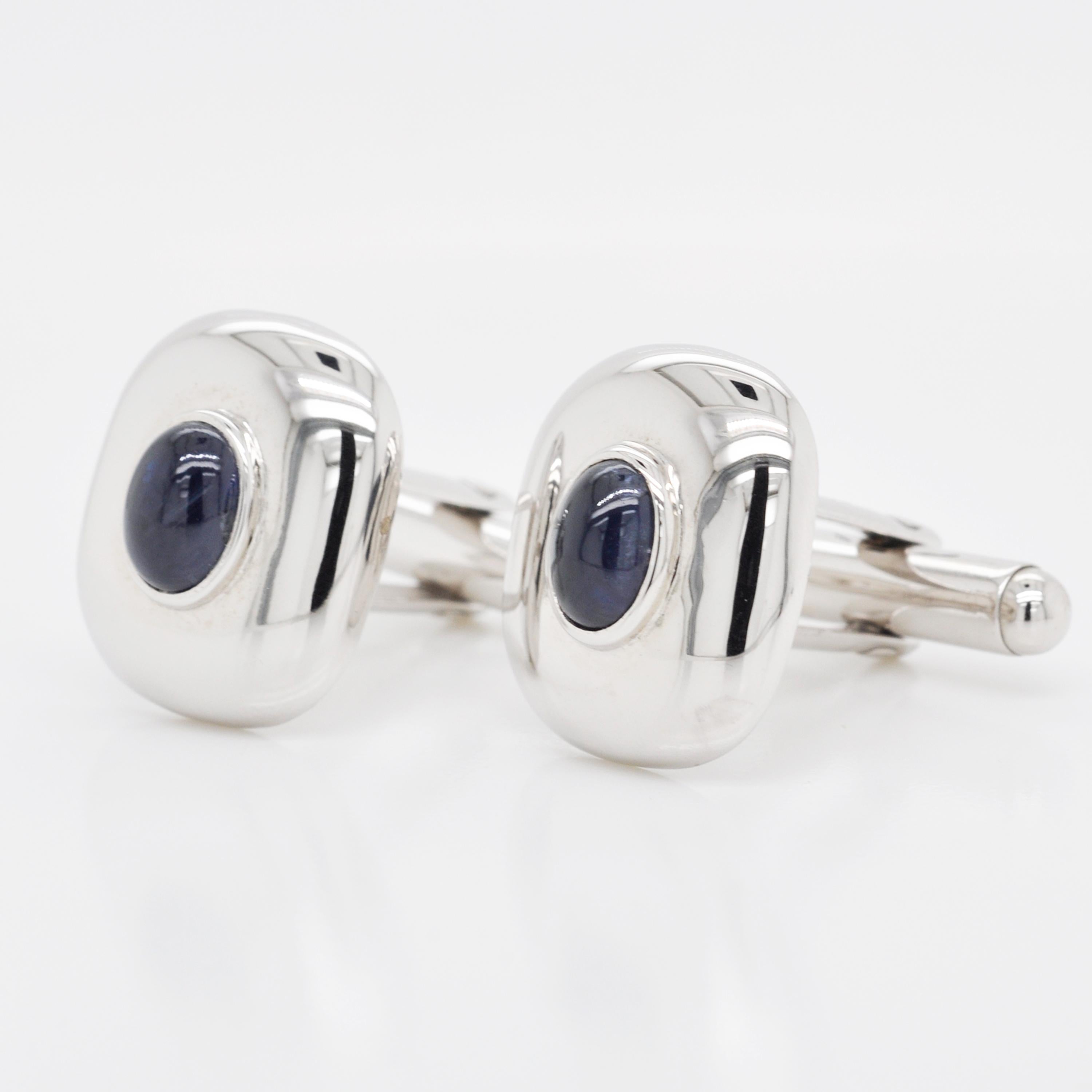 These cufflinks in 925 sterling silver are made in world class finish. Adding to the overall formal appeal is the blue sapphire cabochon at the centre of the antique shaped 925 Sterling Silver Cufflinks. It's perfectly balanced shape adds to the