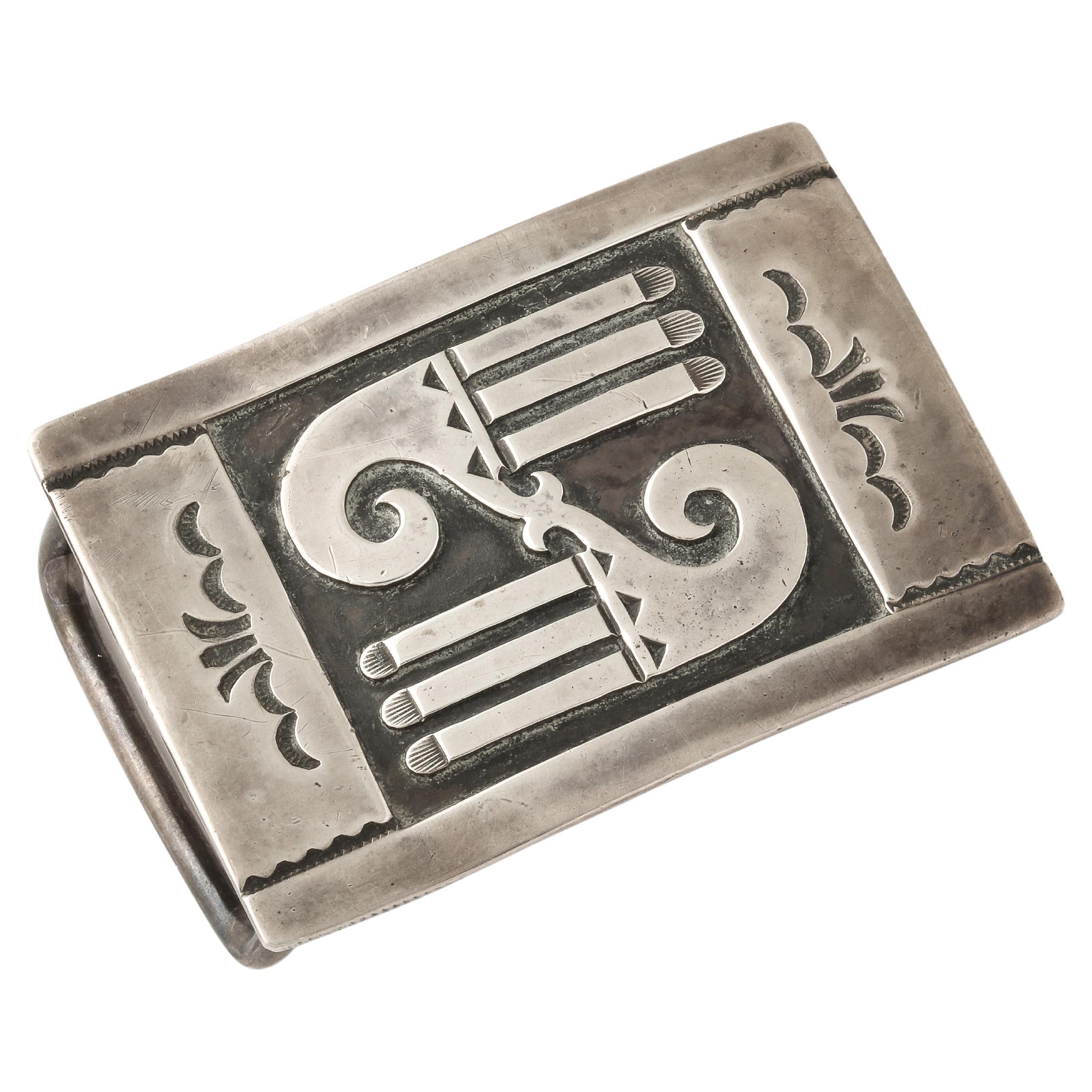 A 1940's original Navajo Belt Buckle is engraved with the old eagle design seen on the earlier Navajo jewelry. The buckle was purchased in the 1970's at a Santa Fe Art Gallery. It is unisex and a size that most belts can slip through. It can be worn