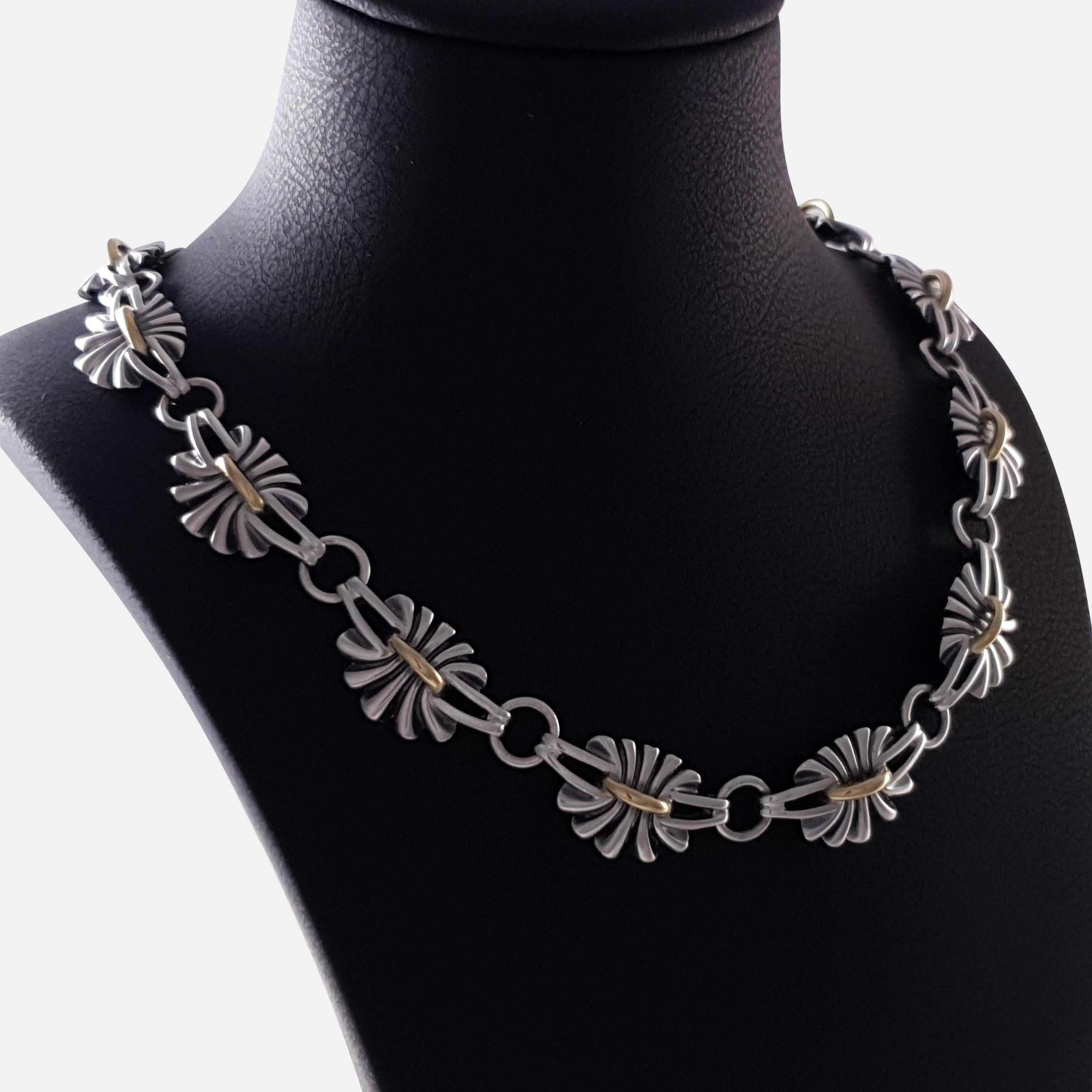 A sterling silver gilt necklace #394, designed by Lene Munthe for Georg Jensen. 

The necklace is stamped with the Georg Jensen within a dotted oval marking (used since 1945), 