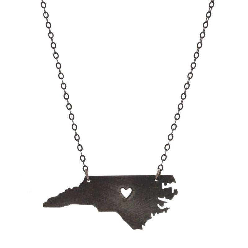 Metal Content: 925 Sterling Silver

Necklace Style: Chain 
Chain Style: Flat Cable
Fastening Type: Spring Ring Clasp
Theme: North Carolina, NC Home Heart 
Features:  Open cut design with brushed finish on pendant

Measurements

Item 1: Attached
