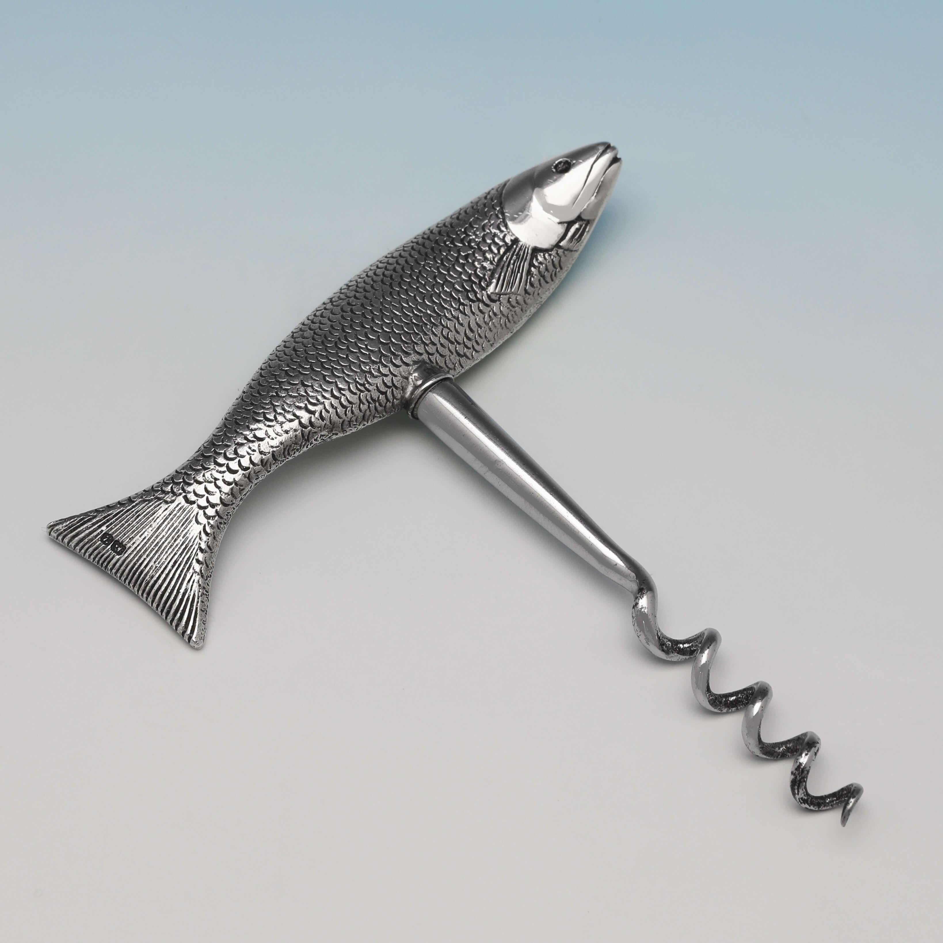 Hallmarked in Birmingham in 1949 by Walker & Hall, this delightful, novelty, sterling silver corkscrew, has the handle modelled as a fish. The corkscrew measures 4