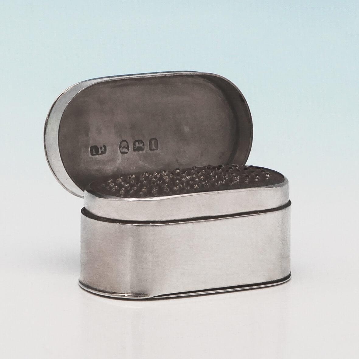 Hallmarked in London in 1804 by John Reily, this handsome, George III, Antique Sterling Silver Nutmeg Grater, is simple in form with curved sides, an original engraved crest and initial 'W' on the lid. The nutmeg grater measures 1