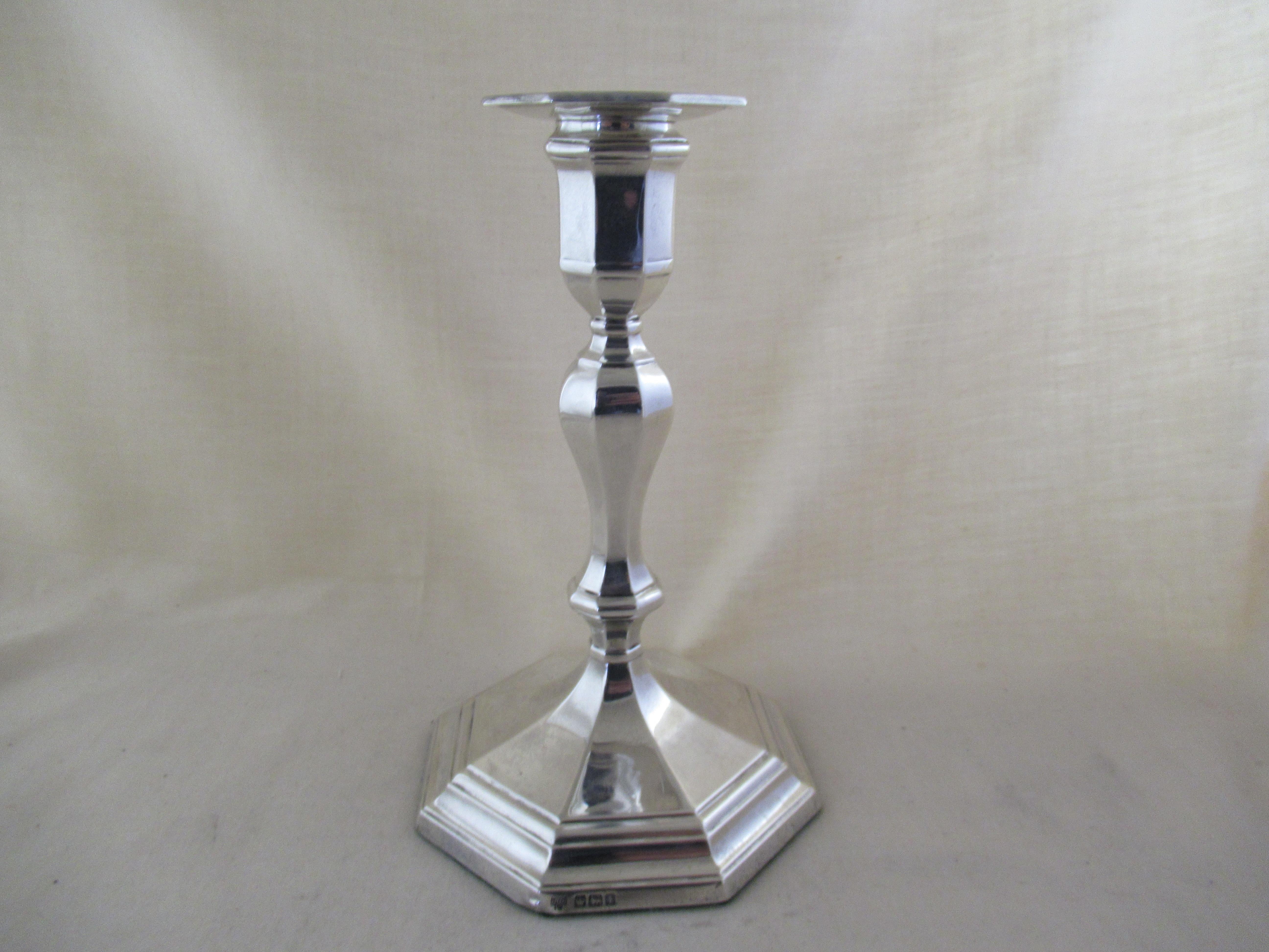 Sterling Solid Silver - ANTIQUE OCTAGONAL TABLE CANDLESTICK
                                         In the Queen Anne style (1702 to 1714)
A full set of English hallmarks which show that it was made in Sheffield 1917
Marks applied by the