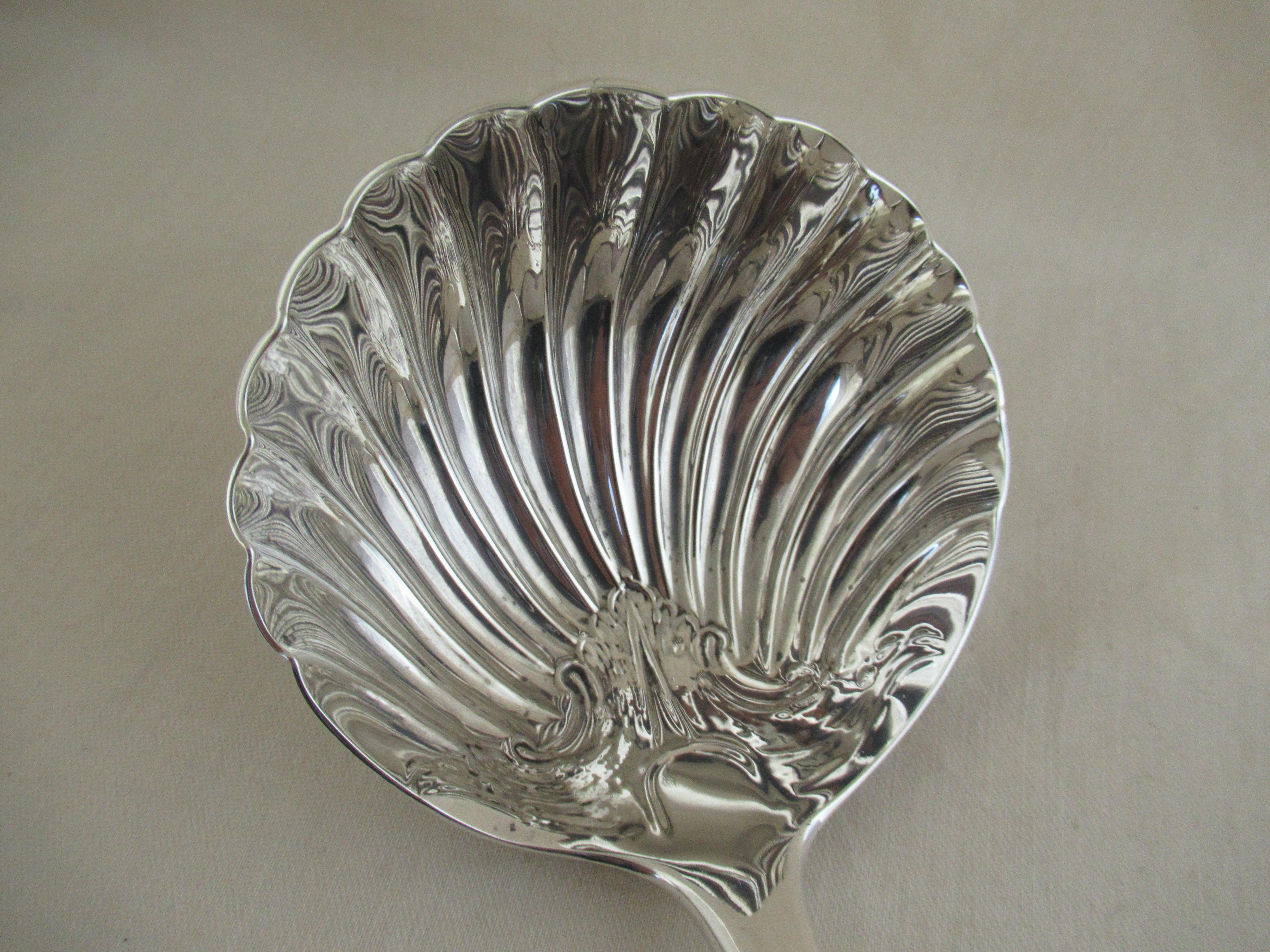 A superb sterling silver - Soup or Punch Ladle.
An ornate decorated shell pattern bowl - almost perfectly round - decorated on both sides.
The Old English shaped stem is beautifully engraved with leaves and a flower.
At the terminal, a shaped