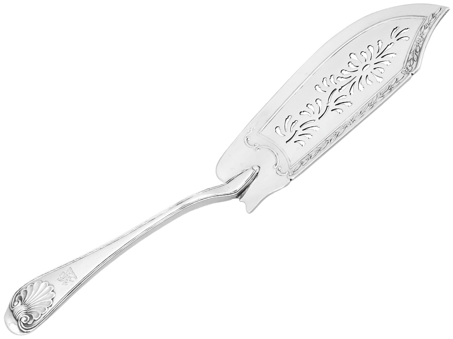 An exceptional, fine and impressive, rare antique Georgian English sterling silver Old English Thread and Shell fish slice / server made by Paul Storr; an addition to our silver flatware collection.

This exceptional antique George III sterling