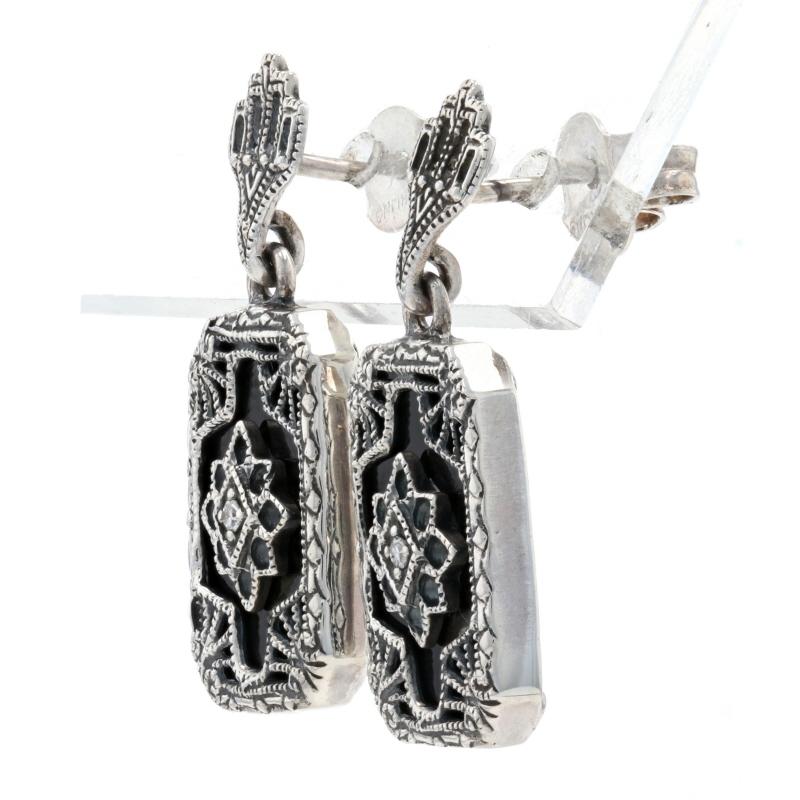 Style: Victorian-Inspired Filigree Dangles
Metal Content: Sterling Silver (stamped)
Stone Information: Black Onyx & Genuine Diamonds
Fastening Type: Stick Posts, Butterfly Backs
Measurements: 1