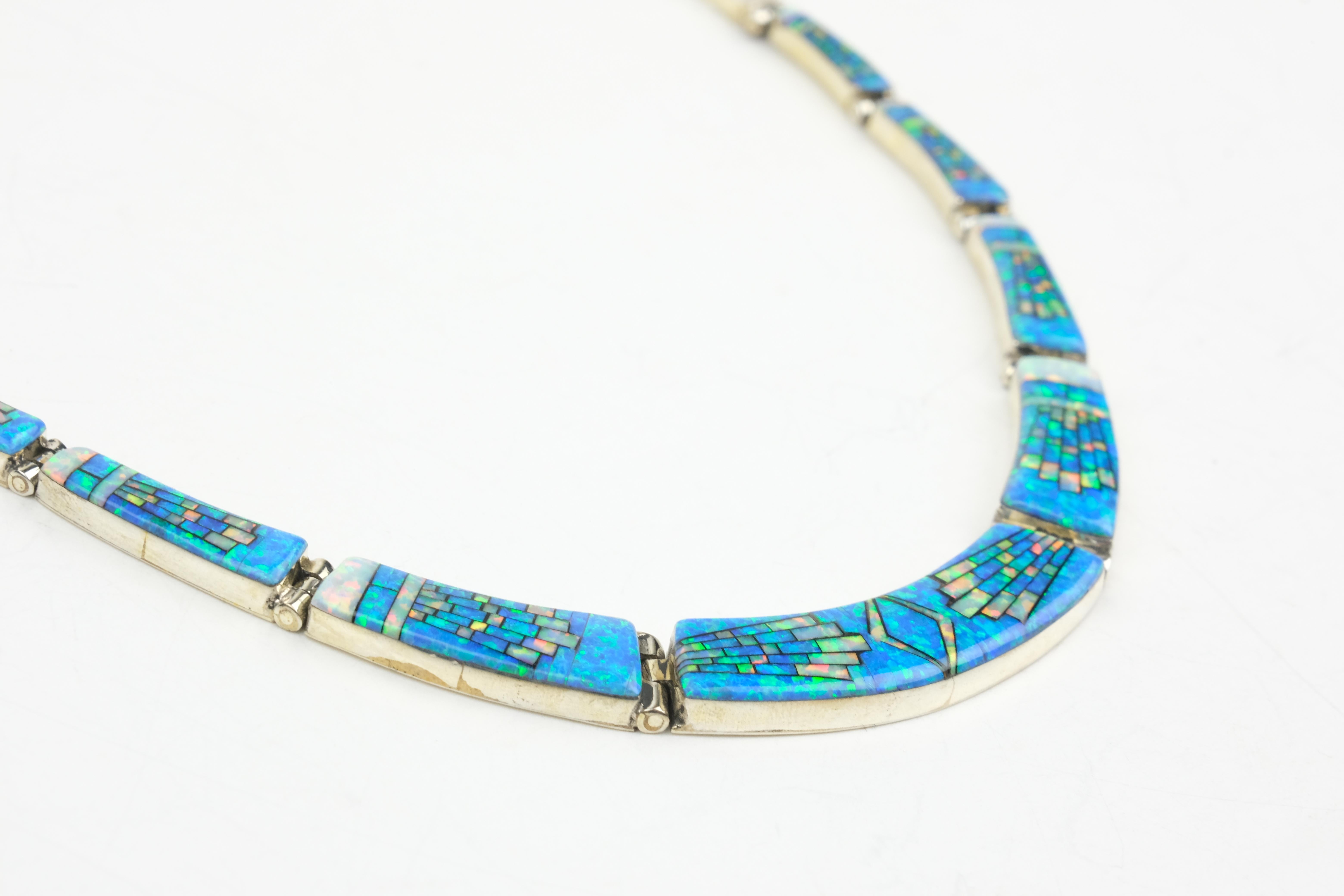 Sterling Silver Opal Inlay Graduated Collar Necklace and Dangle Earrings.

This set comes with matching necklace and earrings.

NECKLACE DETAILS

Materials: Sterling Silver
Necklace Length: 14.75
