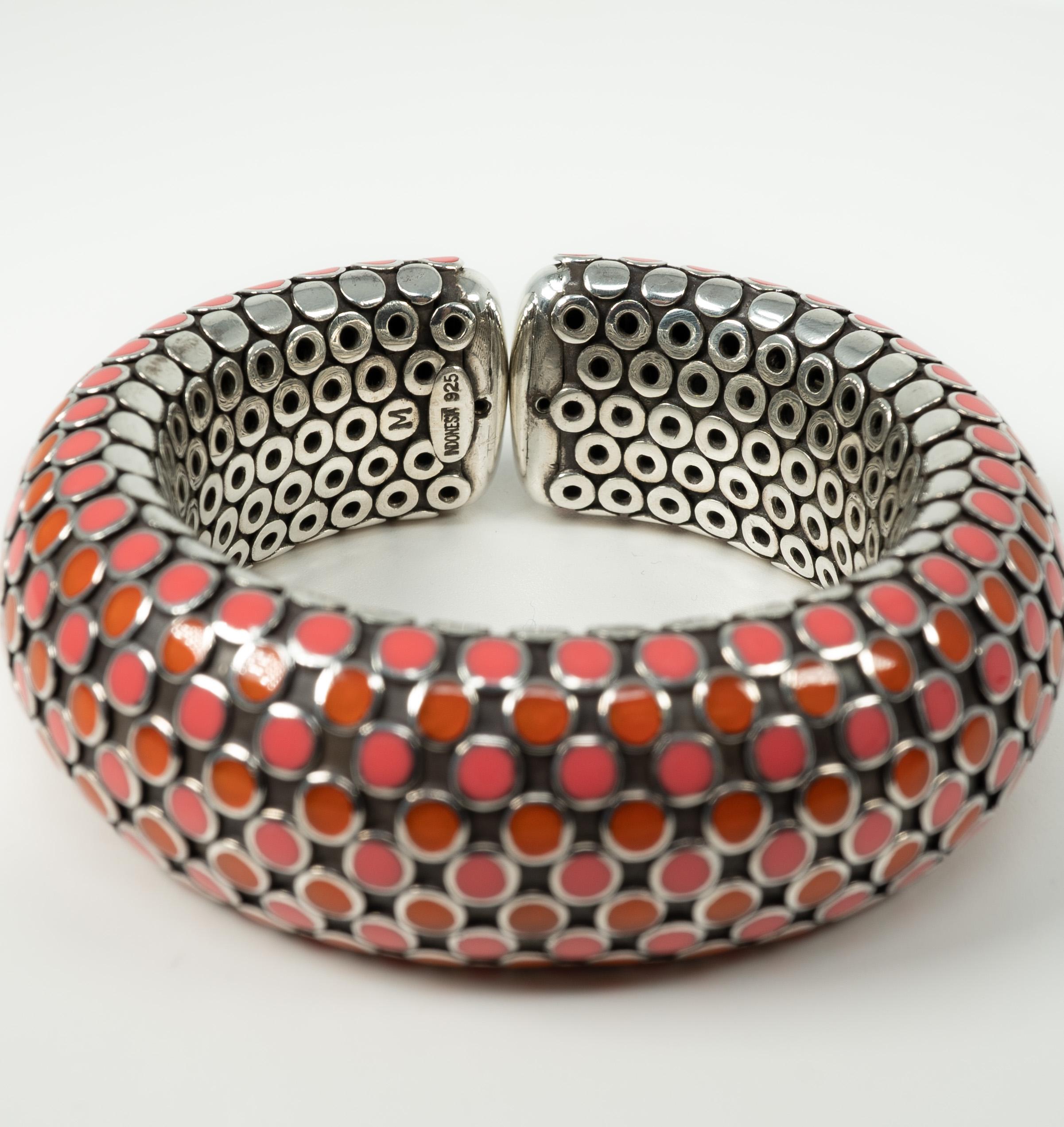 Such a classic!  This sterling silver John Hardy bracelet supports orange and pink enamel dots!

Please note:  the measurements below are approximate.