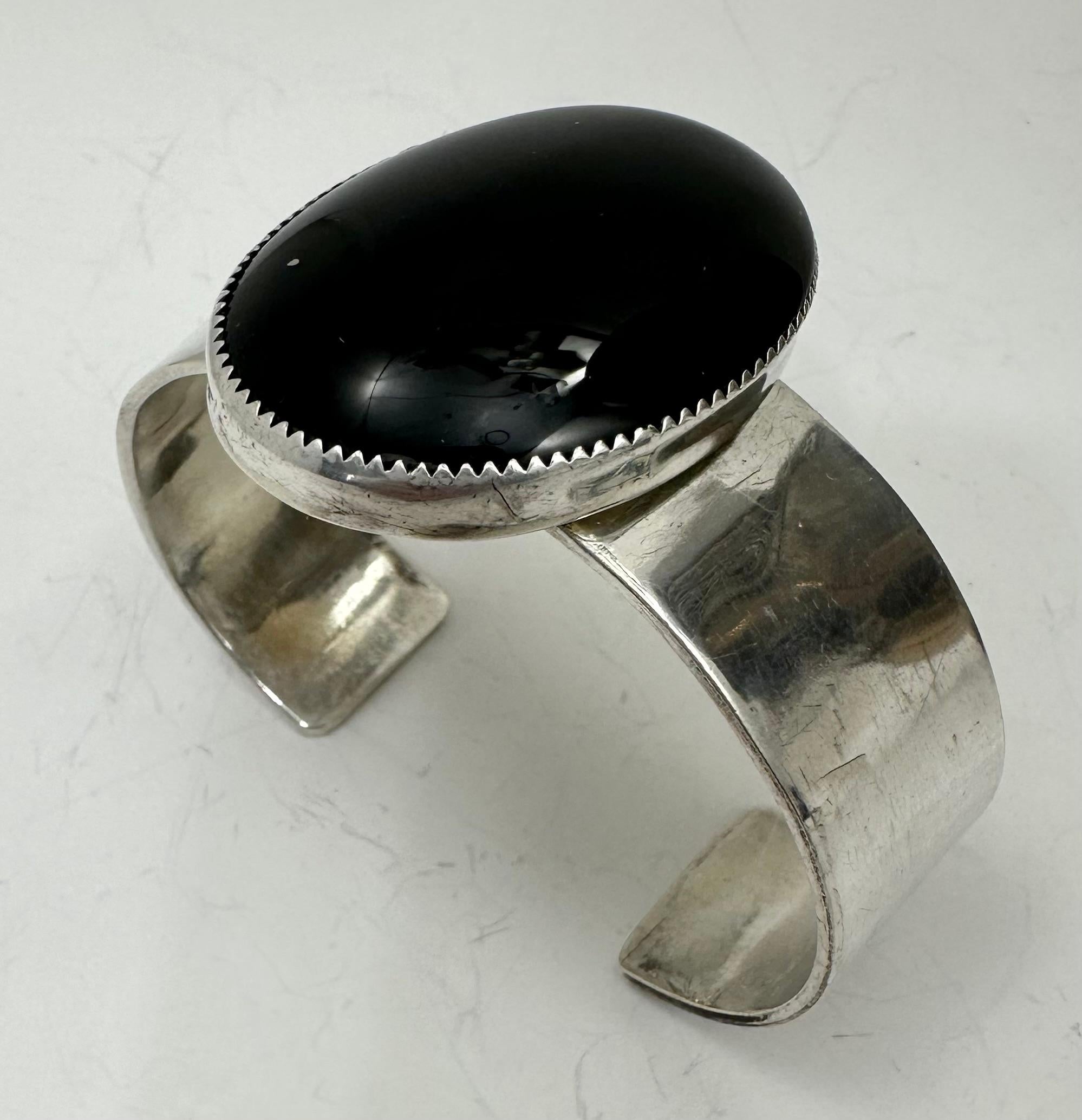 Sterling Silver .925 (30mm x 40mm oval stone) Onyx Cuff Bracelet Signed by Navajo Artist R Henry

History of Black Onyx:
Black Onyx has a rich history dating back thousands of years. Ancient cultures like the Egyptians, Greeks, and Romans held it in