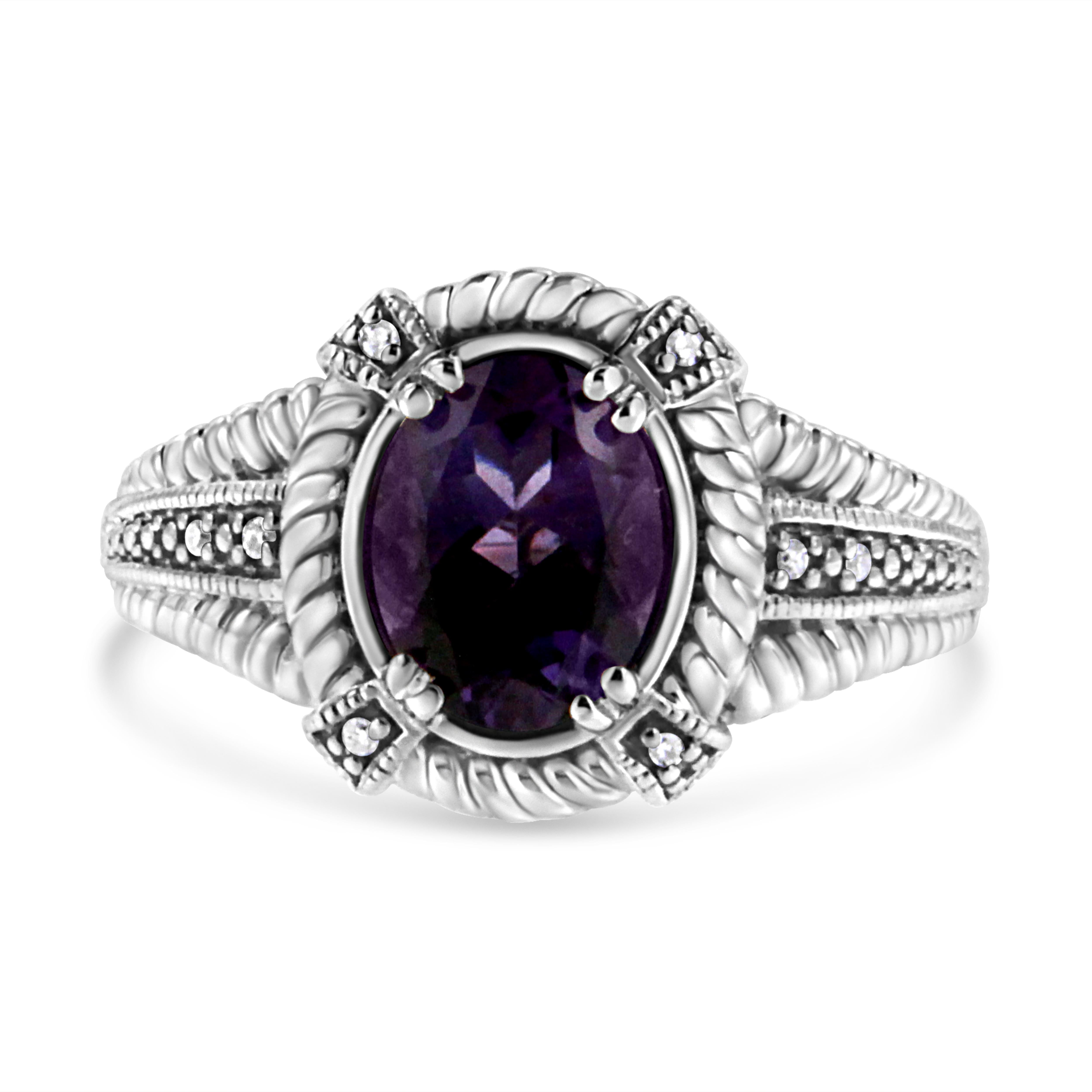 This exquisite amethyst and diamond ring will stun your beloved. Fashioned in radiant sterling silver this dazzling ring showcases a large centrally staged Oval cut Amethyst embellished with 8 pave set single cut diamonds engrossed by a bright