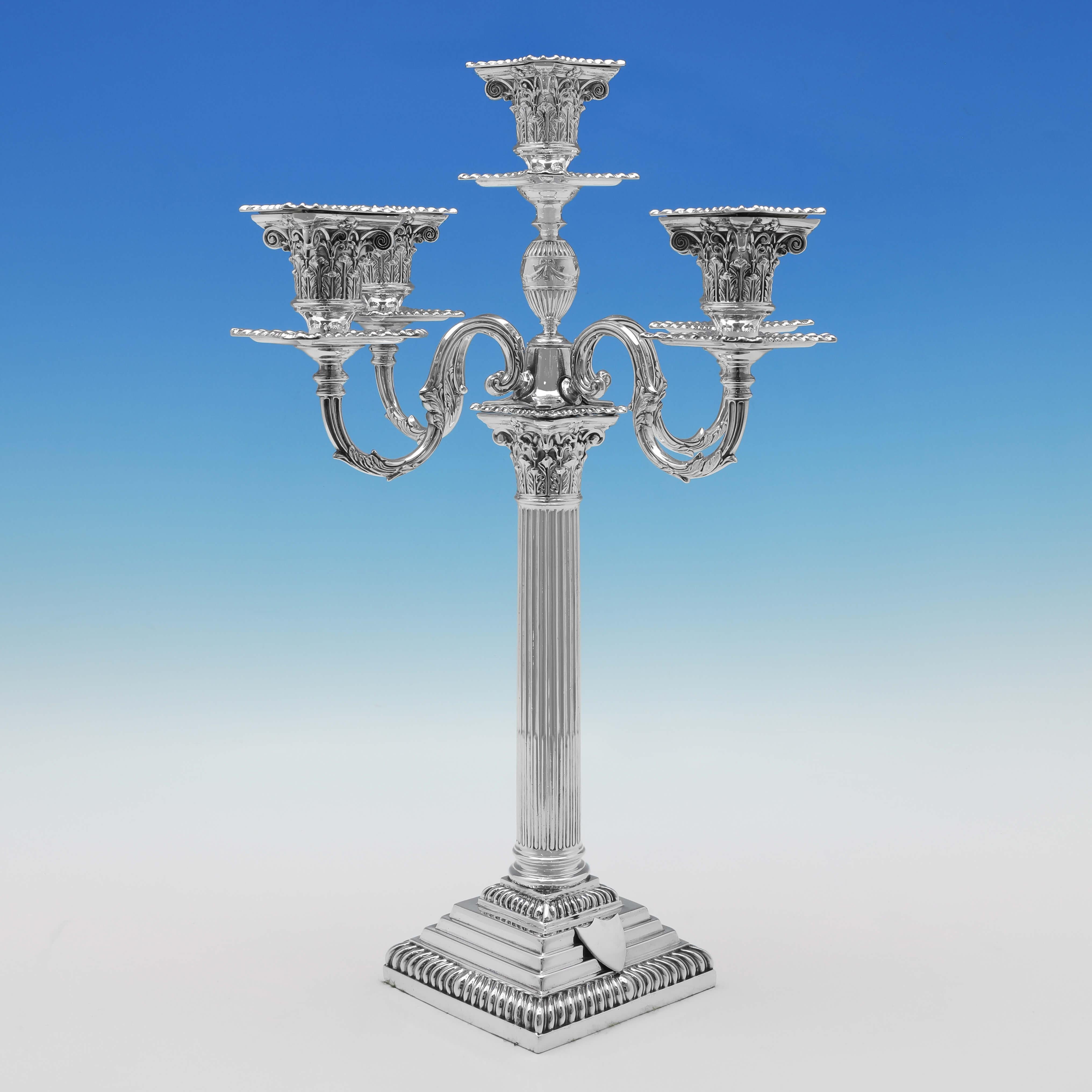 Hallmarked in London in 1896 by Carrington & Co., this attractive pair of Antique Sterling Candelabra, are in the classical Roman 'Corinthian' style, and feature gadroon borders, and applied shields to the bases. The candelabra are in the 5 light