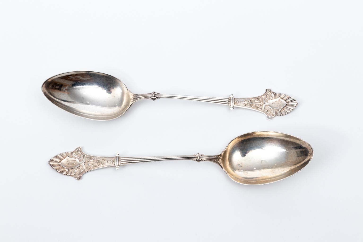 Pair of 19th century Gorham Corinthian sterling silver serving spoons. They weigh 106.6 grams. Made in the United States. Please note of wear consistent with age.