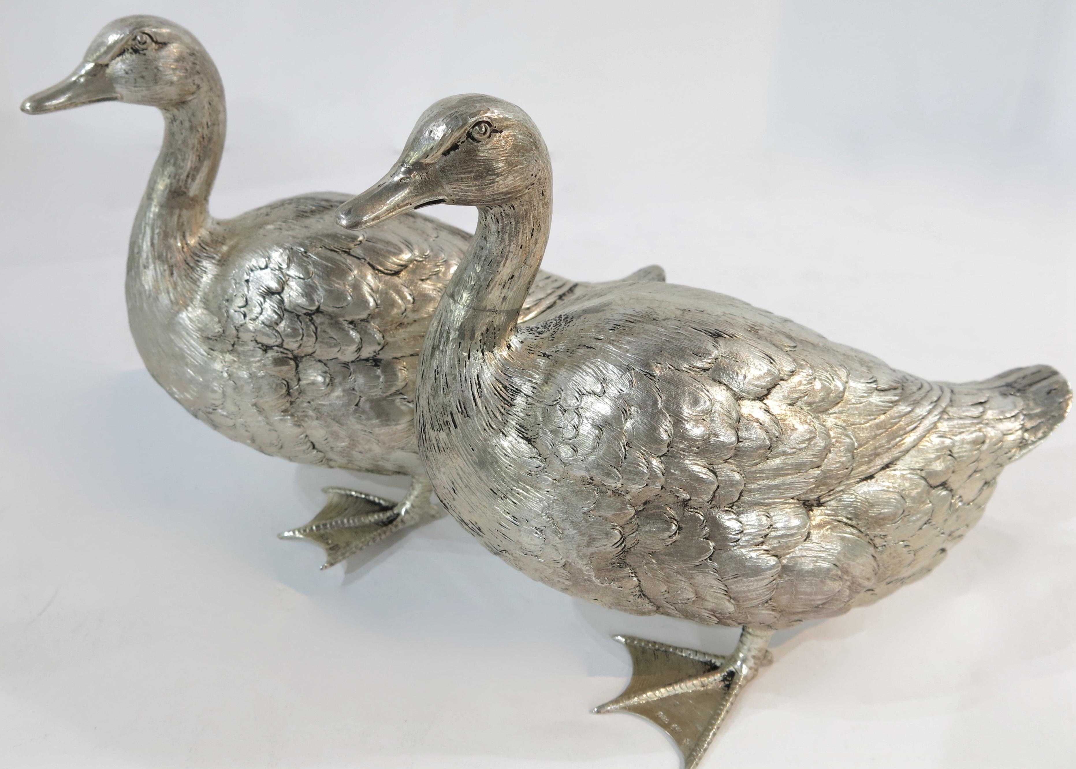 A good quality pair of sterling silver ducks. Each duck is marked with the German half moon and crown mark and 925 on the webbing of their feet.
These ducks are solid silver, not weighted or filled.
Measures: Approximate 6