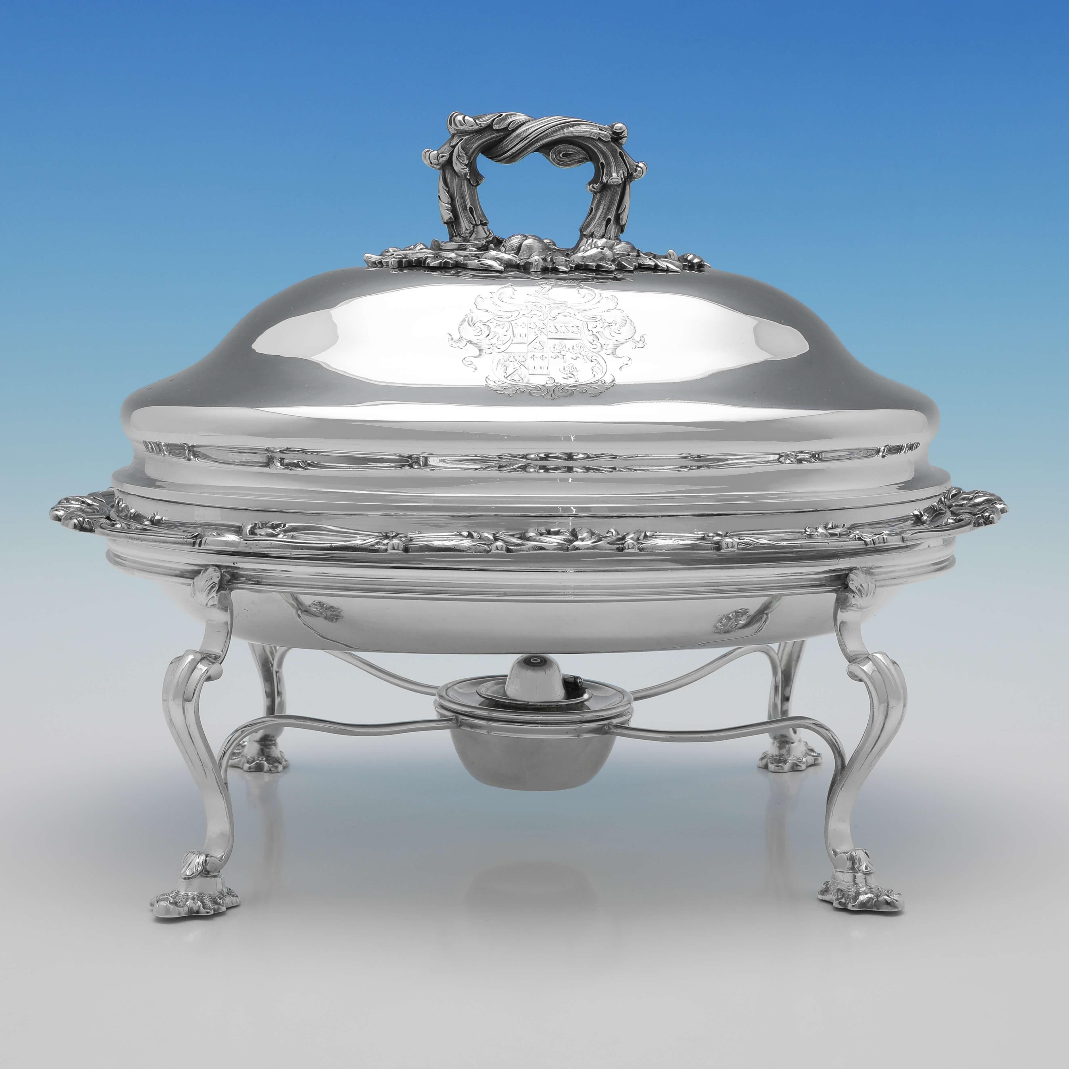 Hallmarked in London in 1830 by Robert Hennell II, this wonderful Pair of George IV, Antique Sterling Silver Entree Dishes on silver plated stands, are generously sized with tall domed lids, and feature acanthus decoration to the border and handle,
