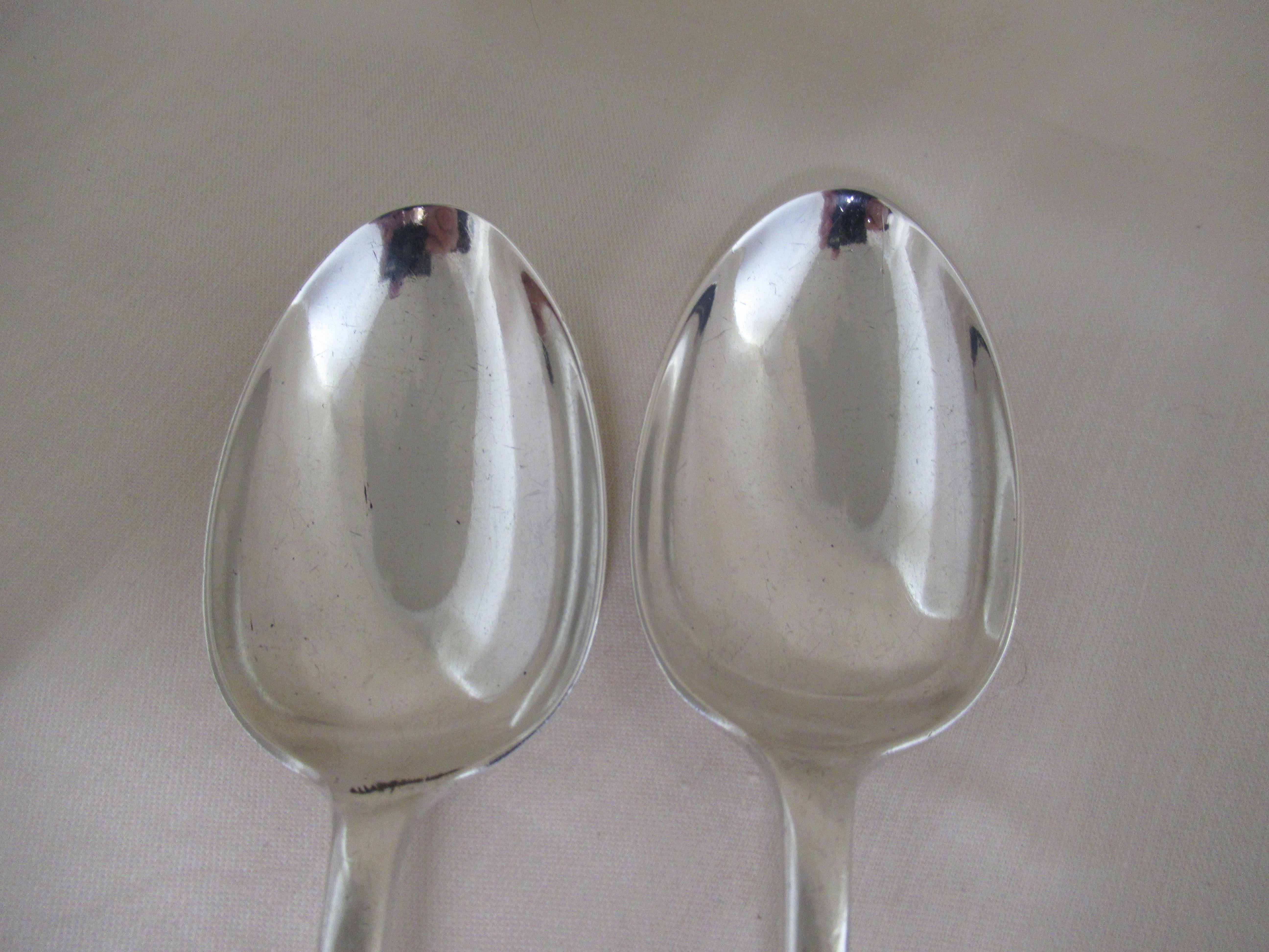 Sterling silver pair of old English tablespoons
Made in 1916, ( 107 years old), by Cooper Brothers & Sons Ltd.,
 Don Plate Works, Arundel Street, Sheffield.
A full set of hallmarks applied by the Sheffield Assay Office:- 
 Crown - Sheffield