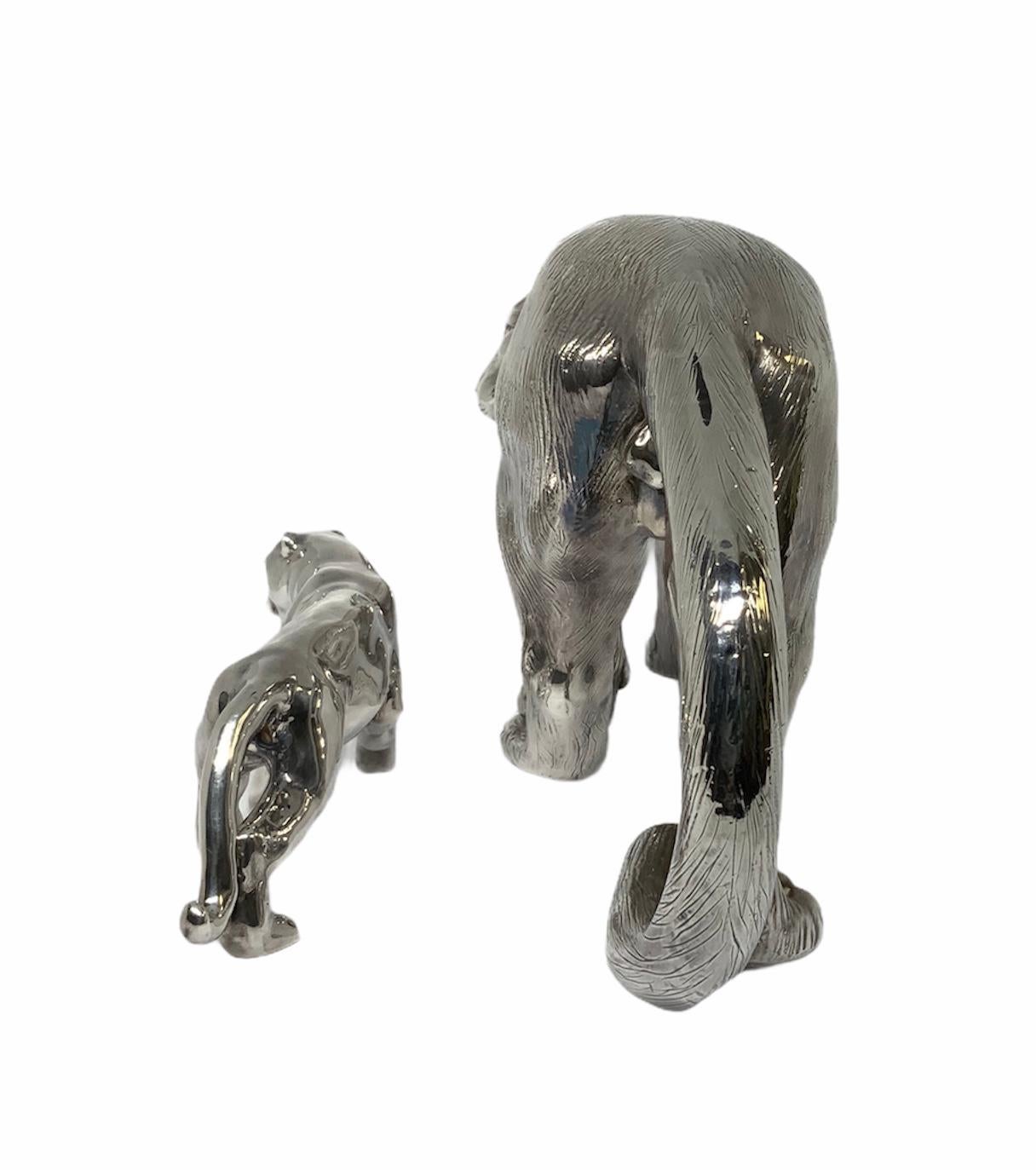This is a sterling silver 925 pair of panthers sculptures/figurines. The largest one-mother/father panther has “hair” engraved to the surface of the body and a caring expression in its face. Baby-panther has a smooth surface of the body and appears