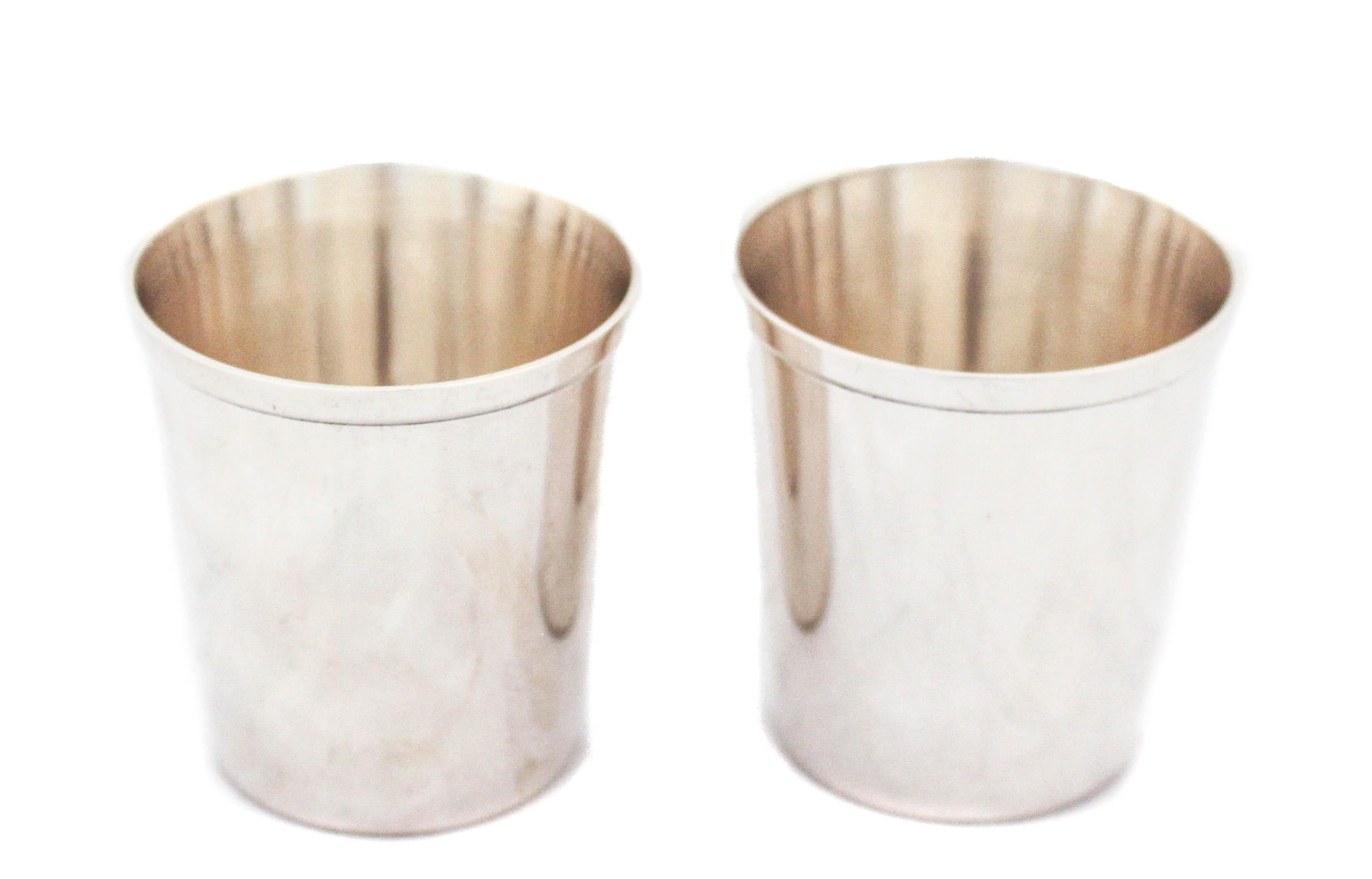 Add this pair of Mid-Century sterling silver tumblers to your bar collection. Designed by the William Durgin Silver Company, they have a sleek understated elegance. Straight lines and no decorative pattern they are masculine and contemporary.