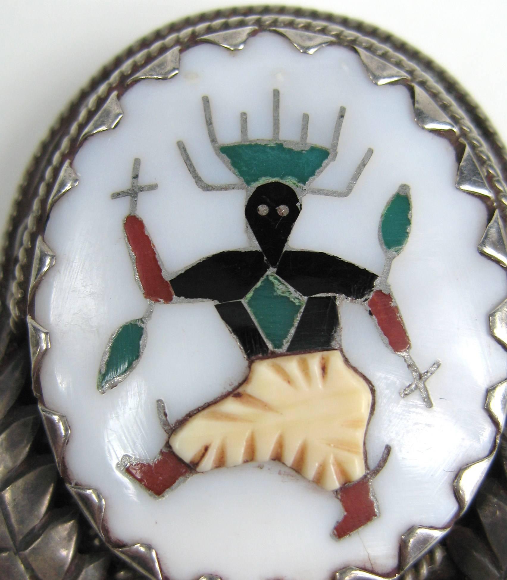 Sterling silver pendant / Brooch  - Hallmarked L.H. Lonjose ZUNI motif is ceremonial dancer set in mother of pearl With coral, onyx, bone, and turquoise by one of the renowned Lonjose family of Zuni Pueblo, N.M. Measures 1.70 Top to bottom x 1.50 