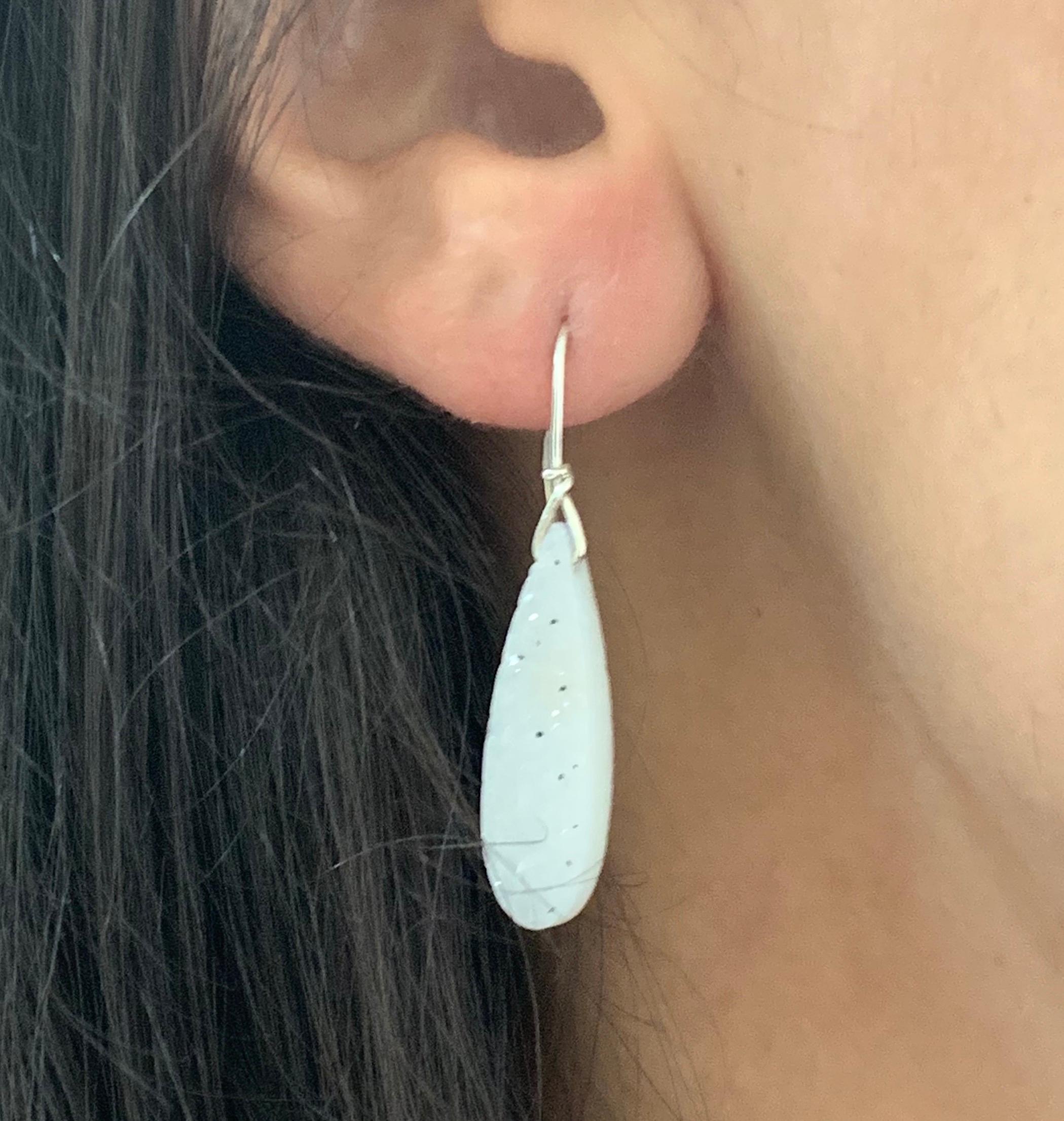 A stunning piece, these Druzy stones are a perfect match in quality and color. These earrings will have all eyes on you!

Material: Sterling Silver
Center Stone Details: Two Pear Shaped Druzys
