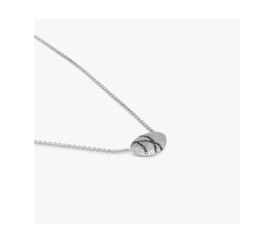 Sterling silver Pebble white diamond necklace with black diamonds

This pendant necklace is formed in an irregular pebble shape and covered in a pave of white and black diamonds. This sterling silver design features a crossover pattern laid out in