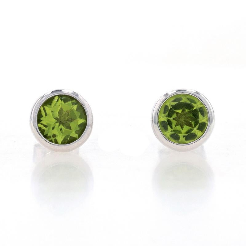 Metal Content: Sterling Silver

Stone Information

Natural Peridot
Carat(s): 1.70ctw
Cut: Round
Color: Green

Total Carats: 1.70ctw

Style: Stud
Fastening Type: Butterfly Closures

Measurements

Diameter: 5/16