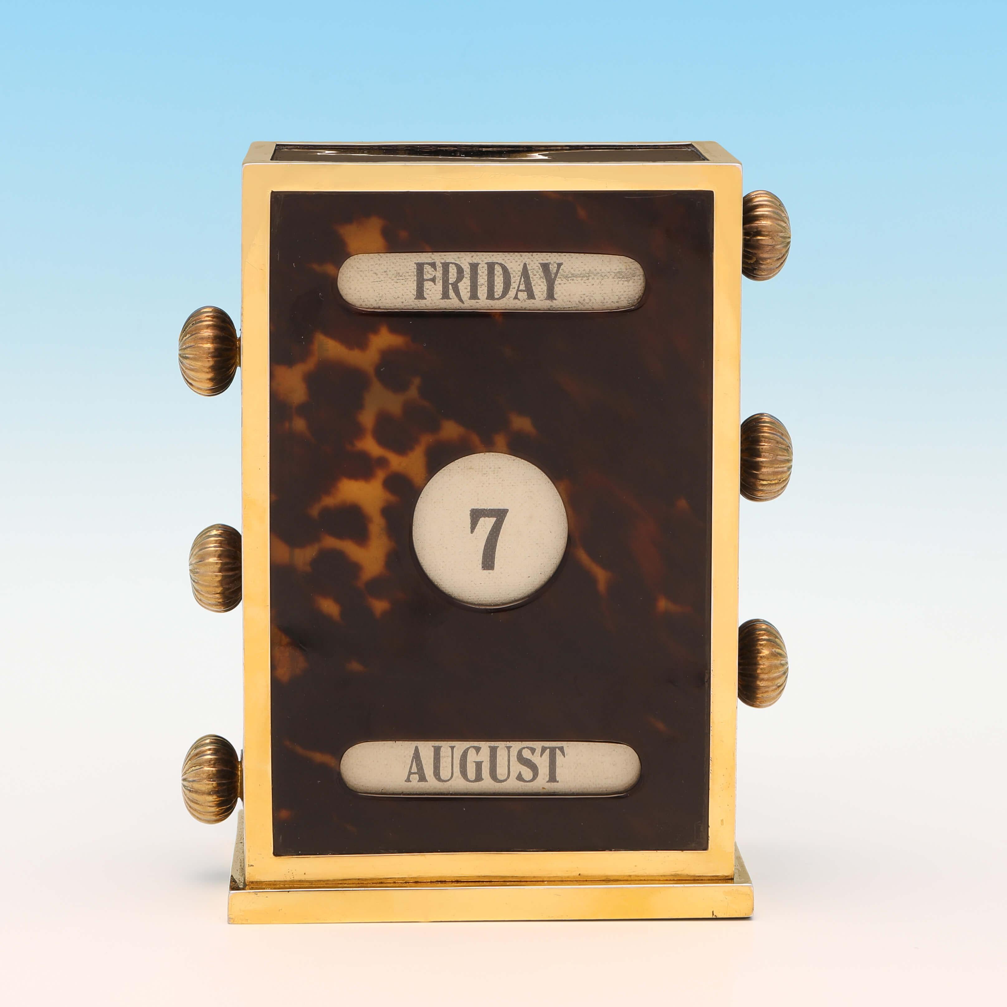 Hallmarked in London in 1919 by John Batson & Sons, this very handsome, antique tortoiseshell and sterling silver perpetual desk calendar, is plain in style, with gilt silver mounts, and is in full working condition. The desk calendar measures
