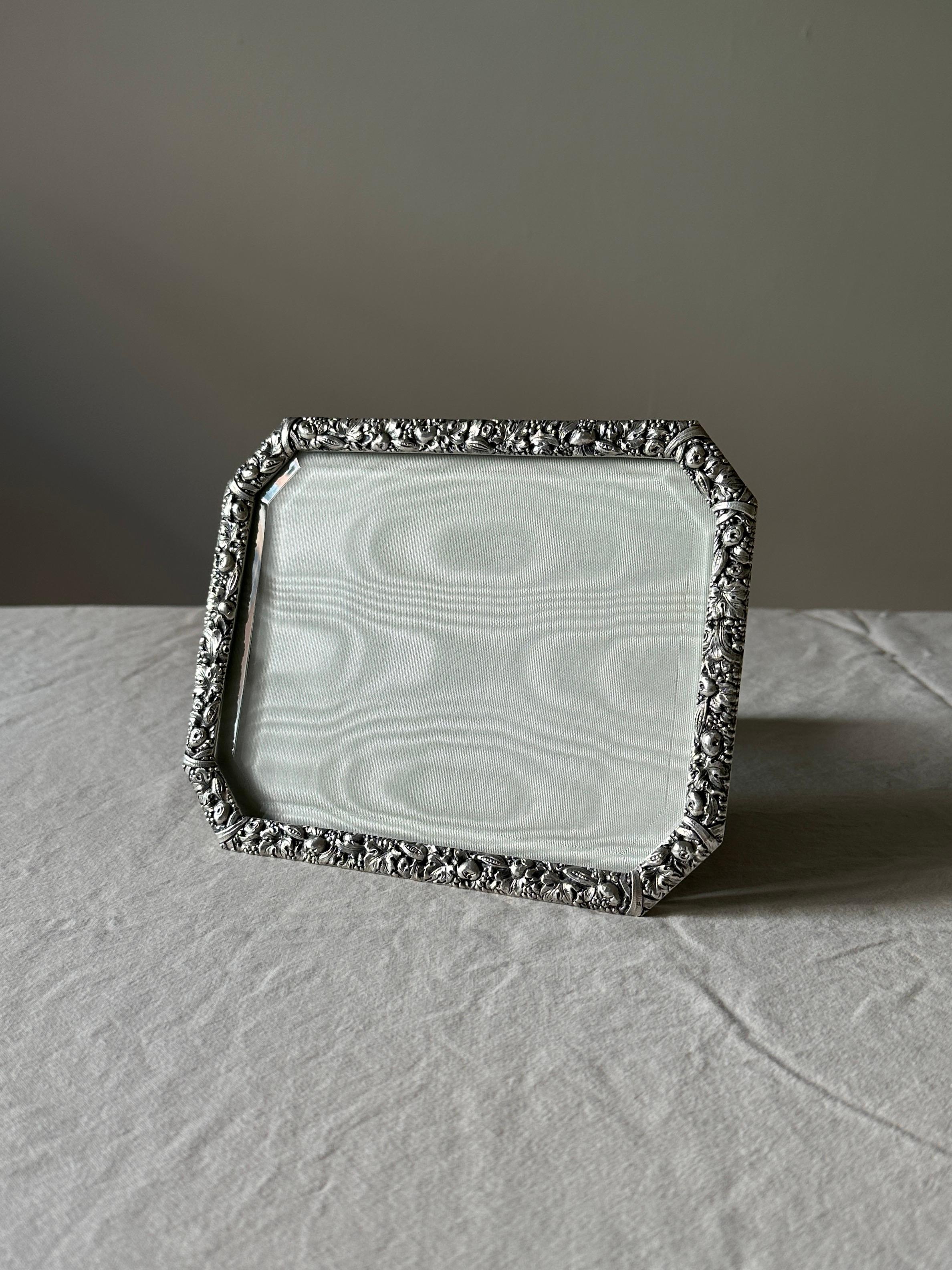 A repoussé Sterling Silver picture frame attributed to Ilario Pradella , Milan, late 20th century (1960/69). Pradella was known for his exceptional work with Buccellati.