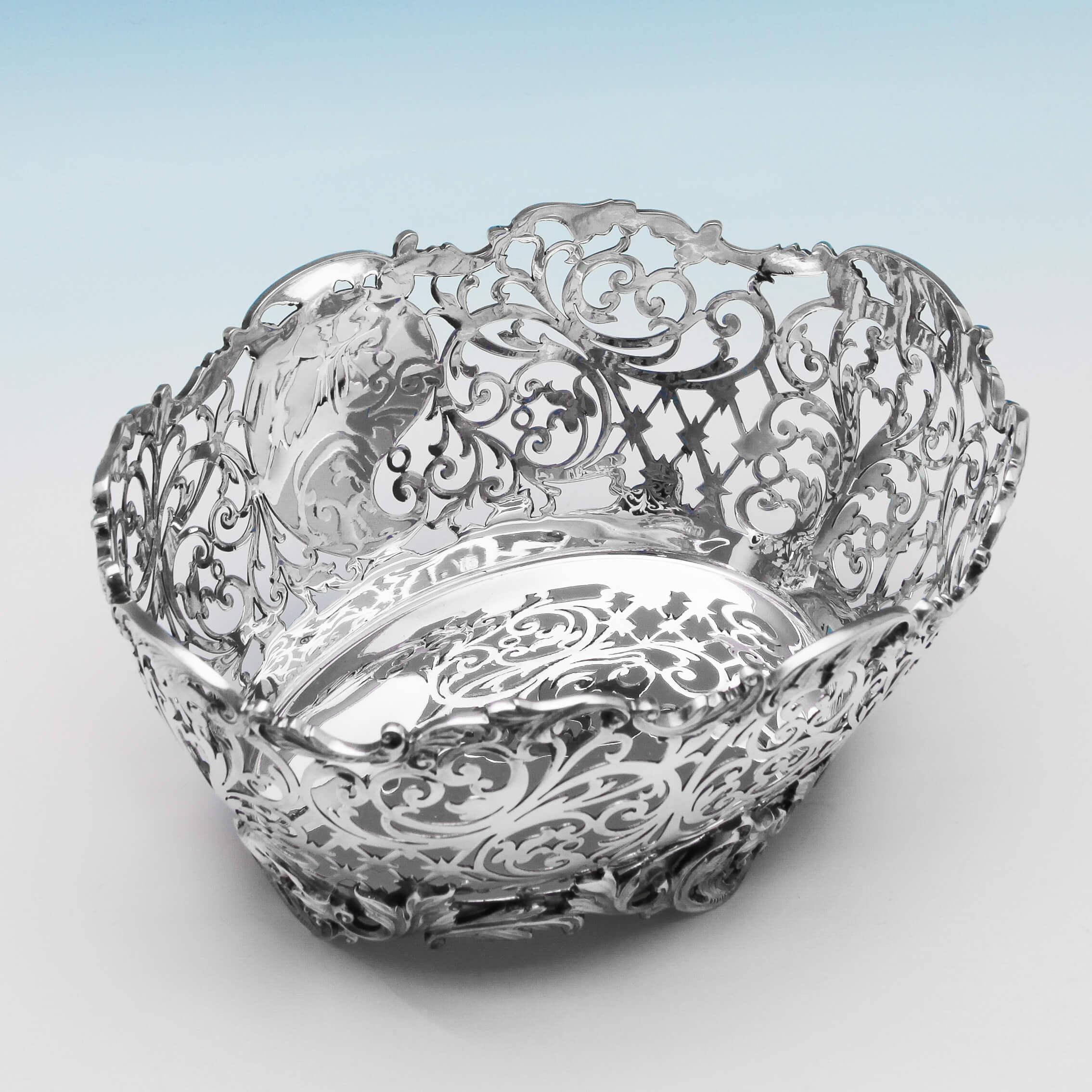 Hallmarked in Sheffield in 1923 by John & William Deakin, this attractive, George V, sterling silver pierced dish, features cast and applied scroll and acanthus leaf borders, and pierced scroll decoration. The dish measures 4