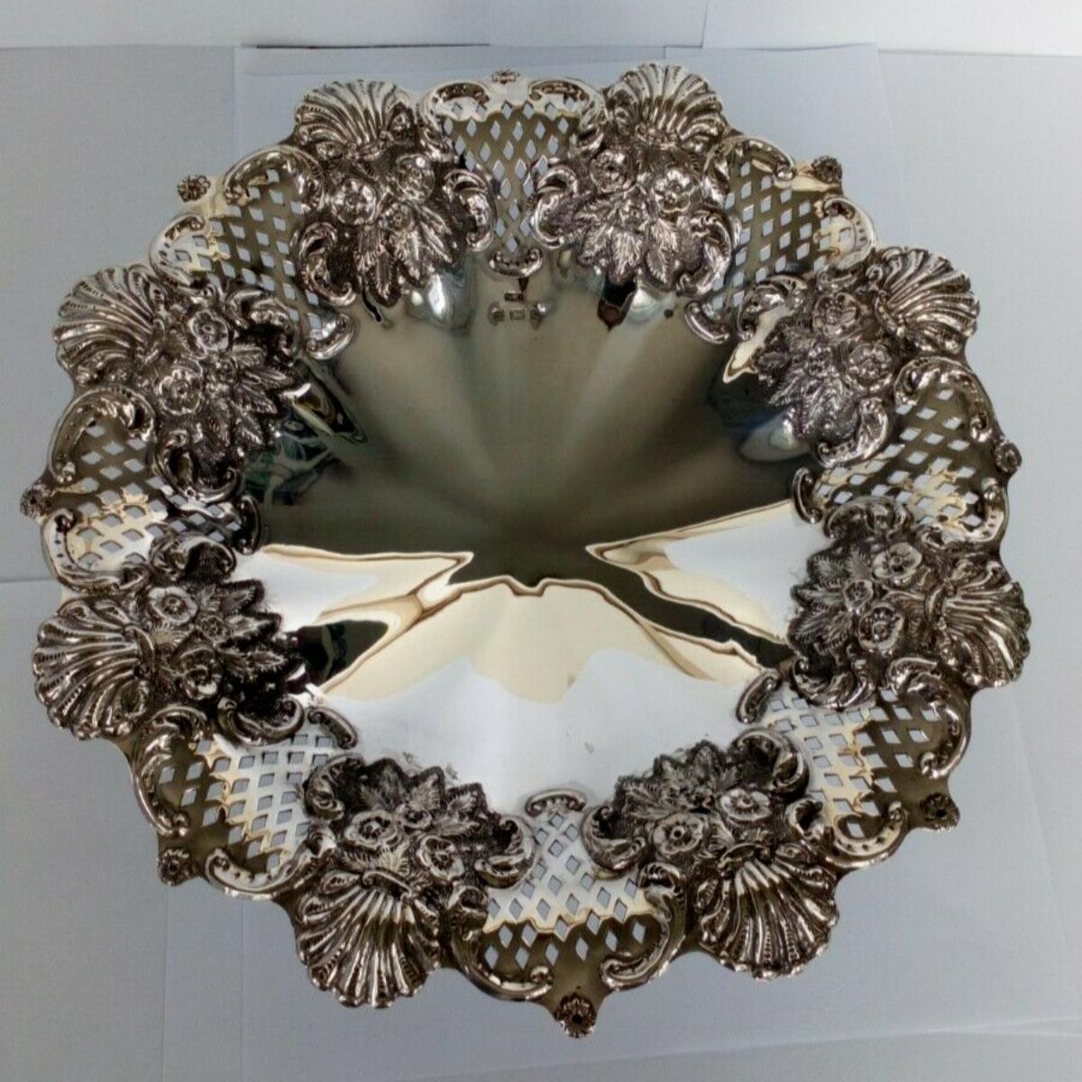 Sterling Silver Pierced Fruit Bowl by William Devenport in Birmingham in 1901

In good condition, this is a lovely piece. It has intricate pierced metalwork. It is decorated with flowers, flourishing leaves and shells. It would look lovely on any