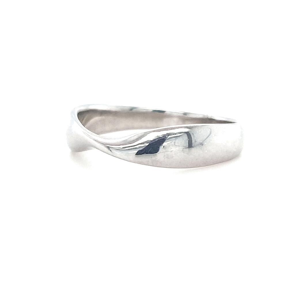 Elevate your love story with the timeless beauty of the Amara Wedding Band in sterling silver. Meticulously crafted, this exquisite piece combines refined charm with understated elegance. The pinch design gracefully captures the essence of enduring