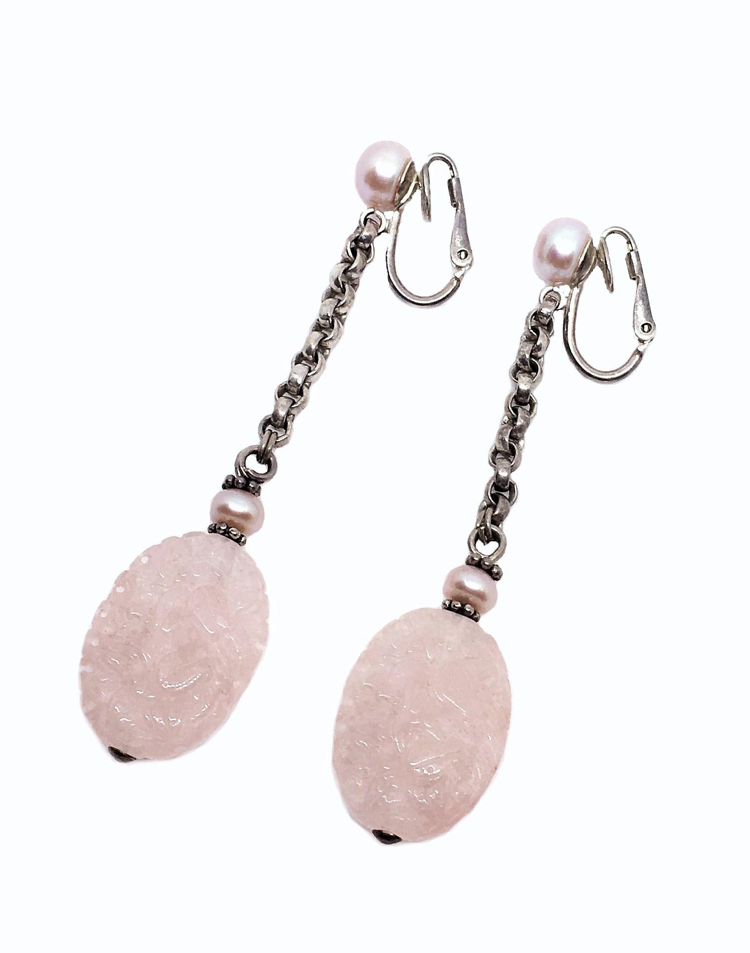 Sterling silver clip-back earrings with pale pink carved oval rose quartz drops, hanging from sterling silver link chains and embellished with pale pink cultured pearls.  Circa 1980s.  Each earring measures 2.75