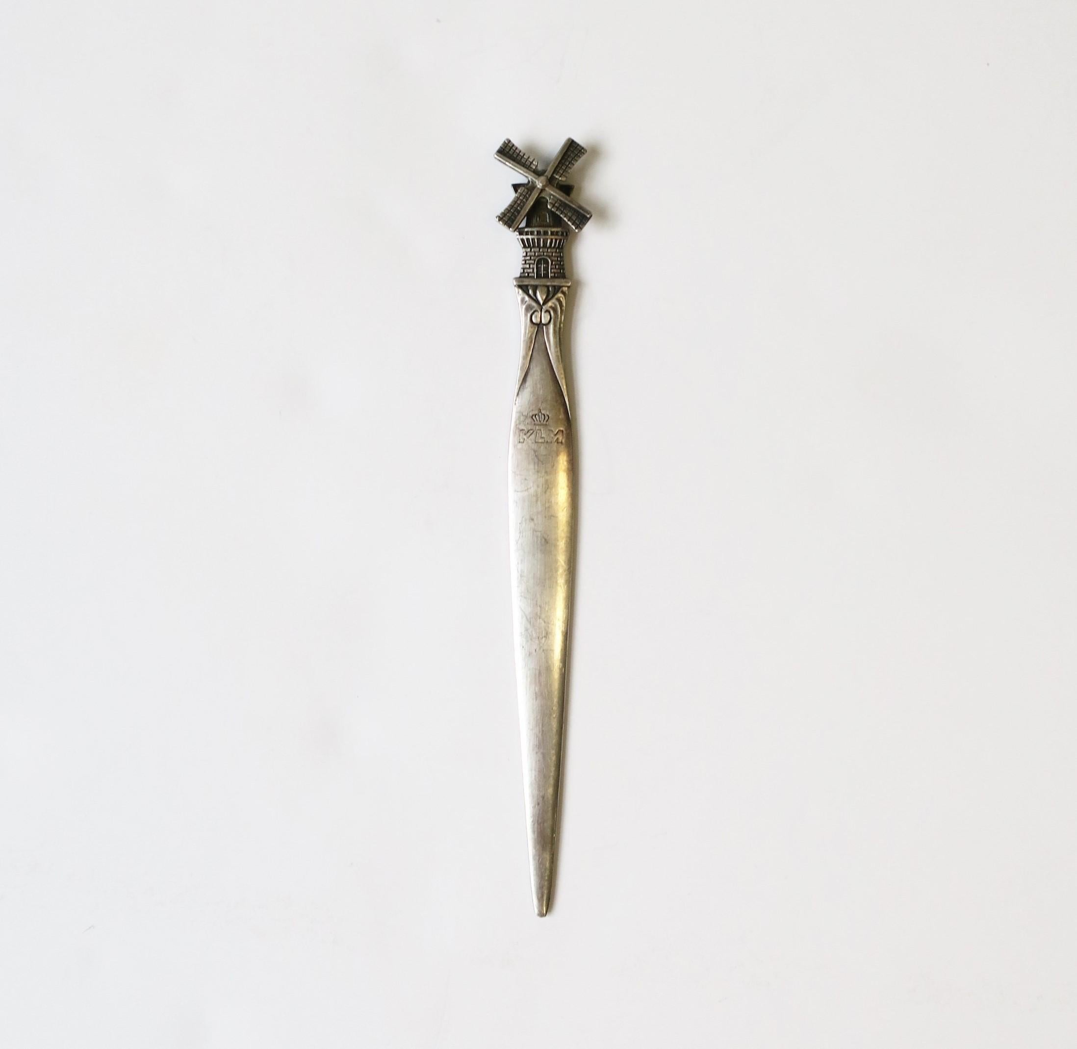 A beautiful sterling silver plate windmill letter opener for KLM Airlines in the Art Nouveau style, circa mid-20th century, Europe, Holland/Netherlands. The windmill's blades rotate 360 degrees. Designer marker's mark on back. Dimensions: .63
