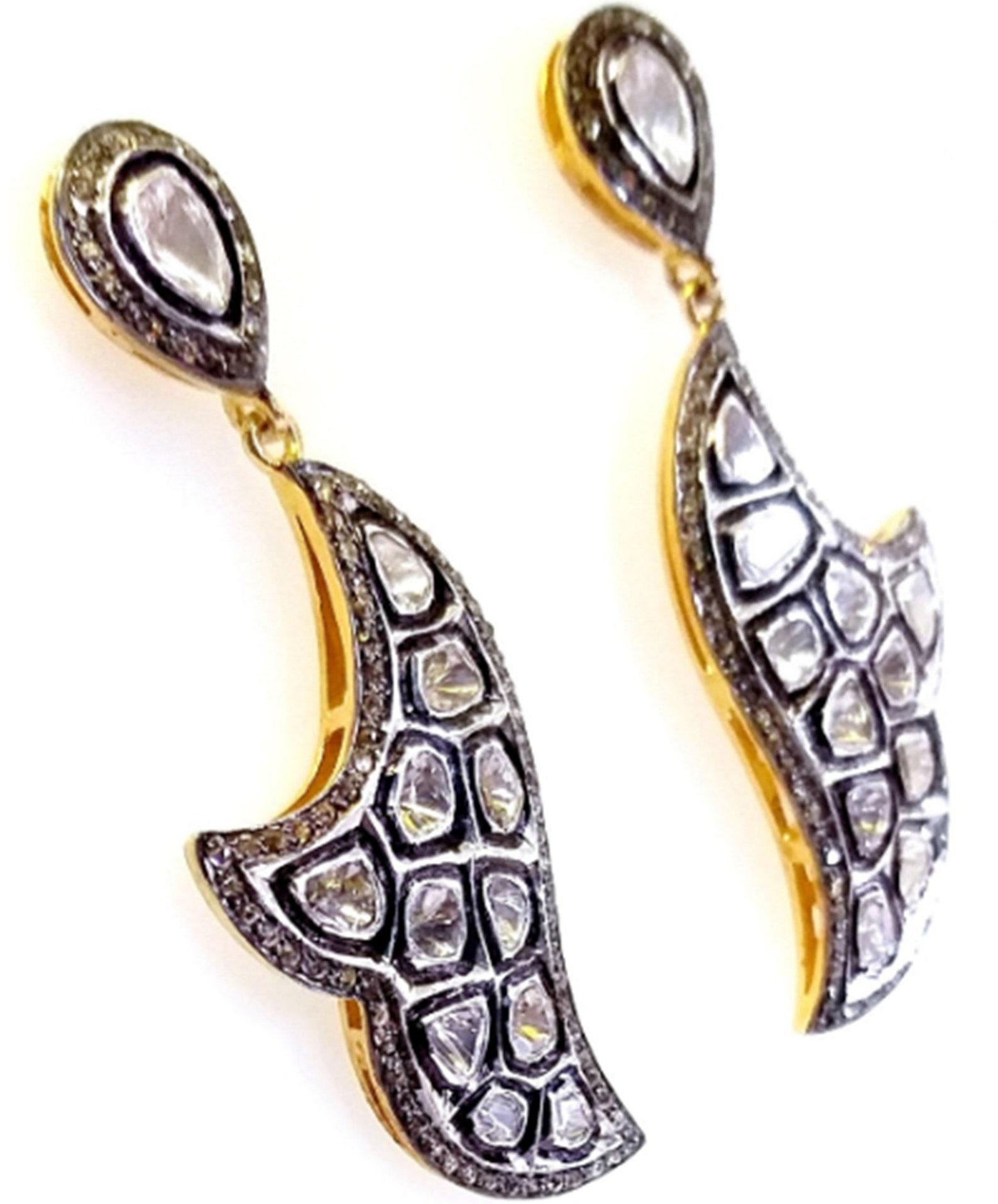 Sterling Silver Polki Diamond Earrings Antique Dangle Earrings 1 Pair Earring. 

Price listed for pair  of Earrings 

Gemstone: Diamond
Location: Earlobe
Closure: Push back
Drop length: 40 Millimetres
Length: 50 Millimetres
Width: 18 Millimetres

A