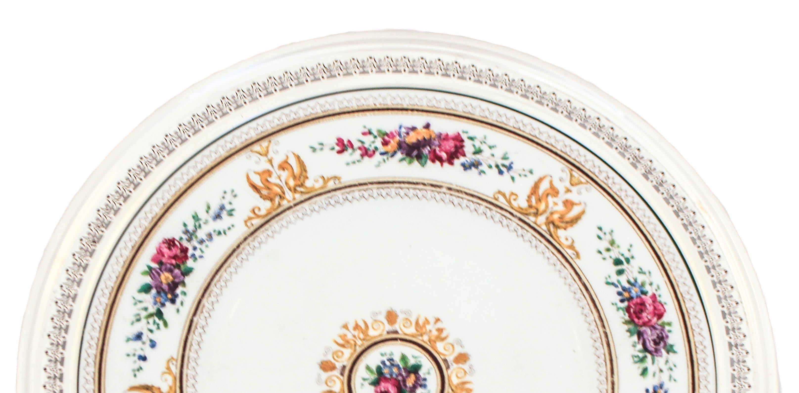 Being offered is a sterling silver and porcelain tray.  The sterling silver rim was designed and manufactured by George Henckel & Company while the porcelain tray was manufactured by Wedgwood of England.  The silver rim has a cutout motif going all