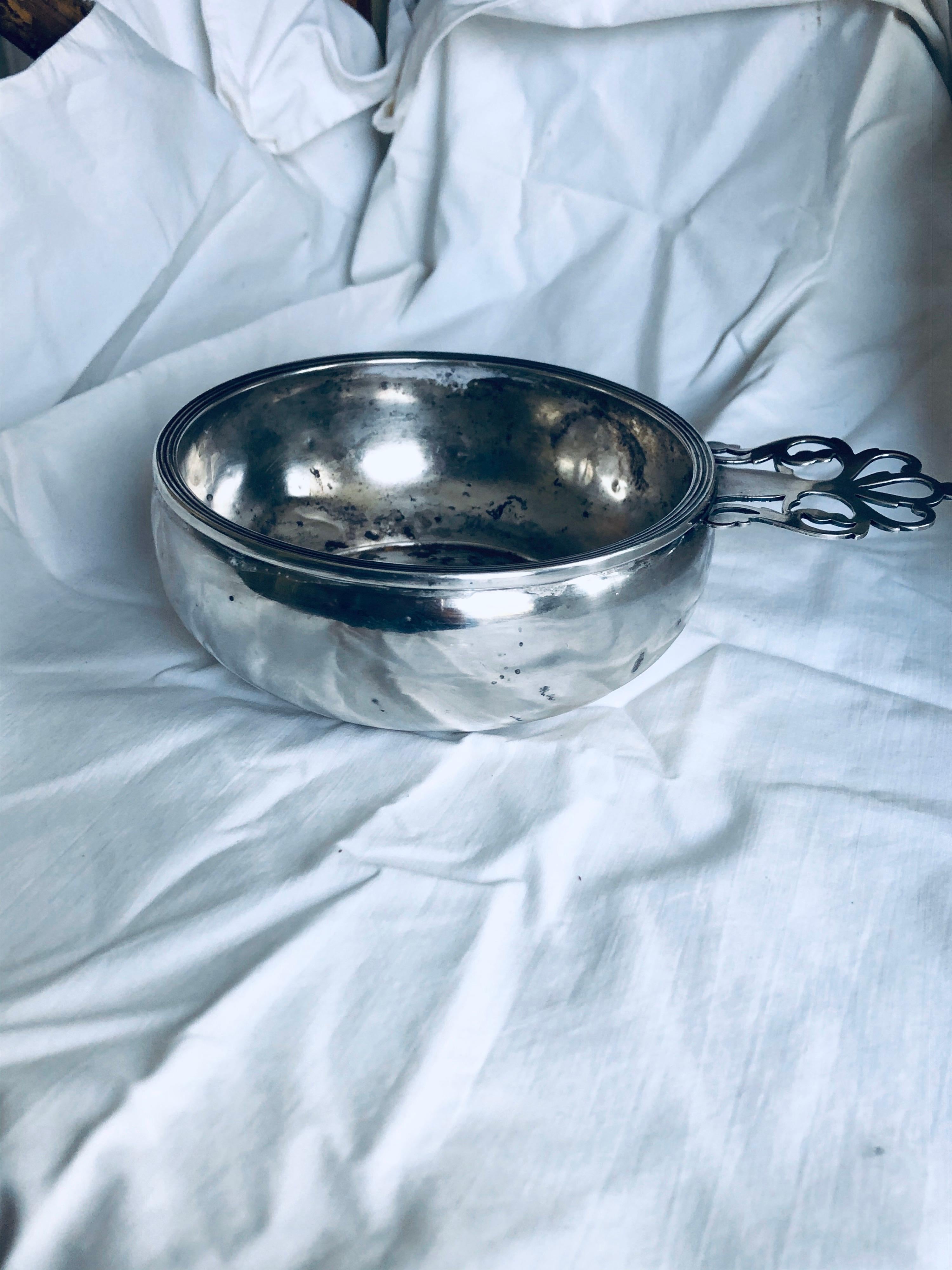 Sterling silver porridger with pierced handle, circa 1950. Ellmore Silver Company. This was used as an ashtray, so there are marks on the interior of the bowl. Monogrammed 