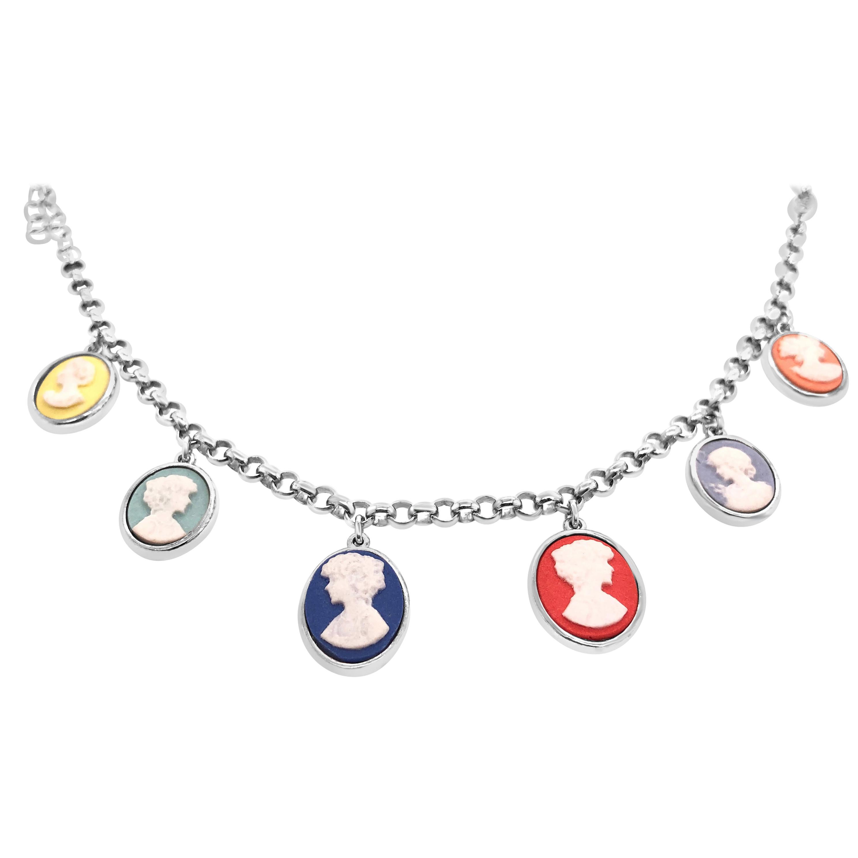Beautifully hand crafted porcelain cameo mounted in rhodium plated sterling silver. With a modern look this fun charm bracelet is the perfect addition to your trendy wrist. Depicting the most classic cameo subject with a selection of vibrant colours