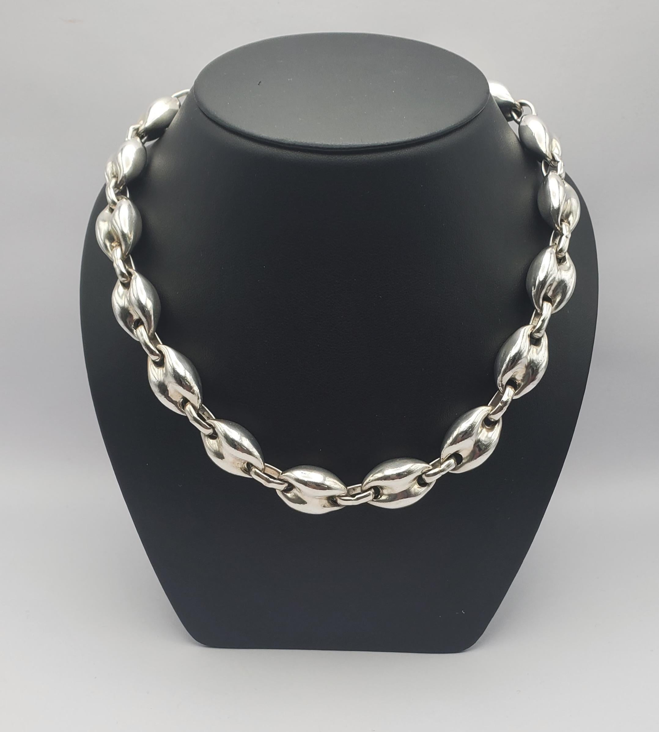 Gorgeous puffed Gucci style link statement necklace in sterling silver. This substantial necklace features solid links and a oval shaped box clasp. The hallmarks stamped on the back of the clasp read: TS-54 Mexico 925. The TS-54 indicates the piece