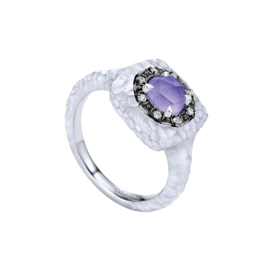 Ladies' Sterling Silver, Purple Jade and White Sapphire Fashion Ring. Hammered finish top with a soft cushion cut line showcases a purple jade with white topaz top, and is surrounded by a black rhodium halo with white sapphires. Total gemstone