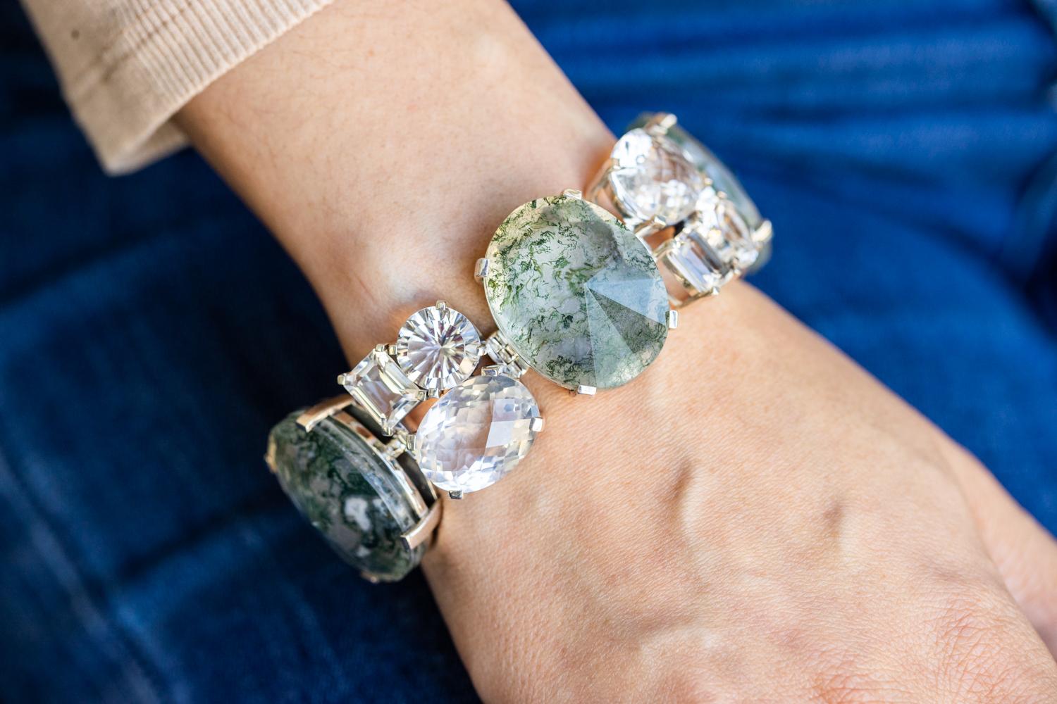 The natural quartz and faceted moss agate bracelet by Stephen Dweck beautifully showcases his expertise in combining unique gemstones with sterling silver. This bracelet features alternating natural quartz and moss agate stones, each faceted to