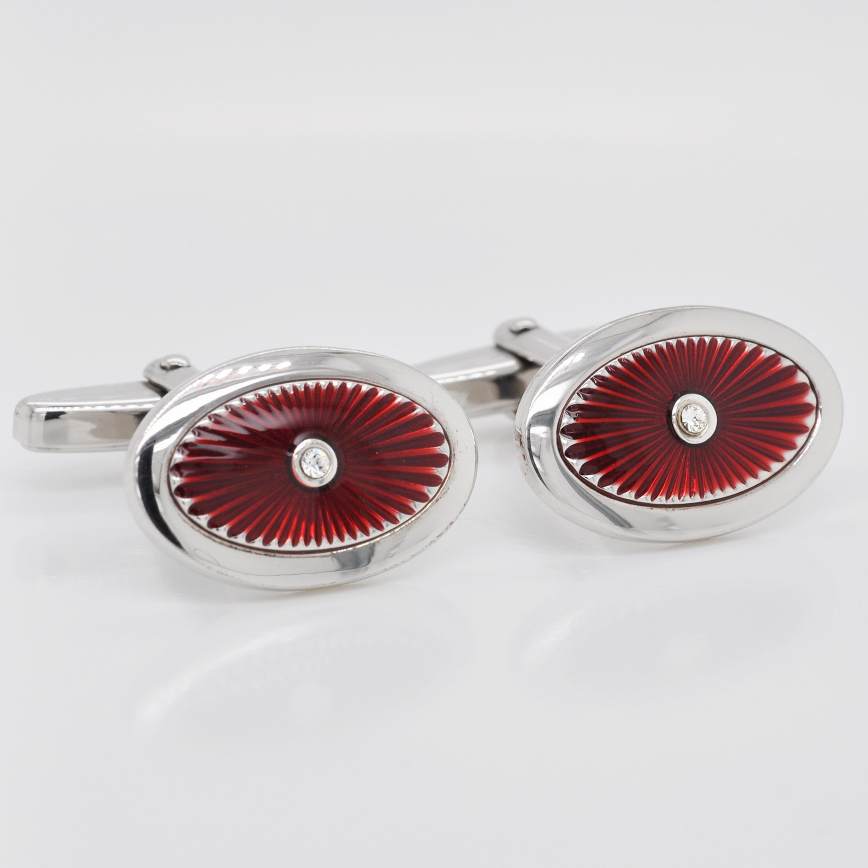 Made from sterling silver, these cufflinks are the perfect mix of contemporary style with a dash of deep red colour. These oval shaped cufflinks feature stunning deep red guilloché enamel with radiant patterns under the enamel, enveloped within