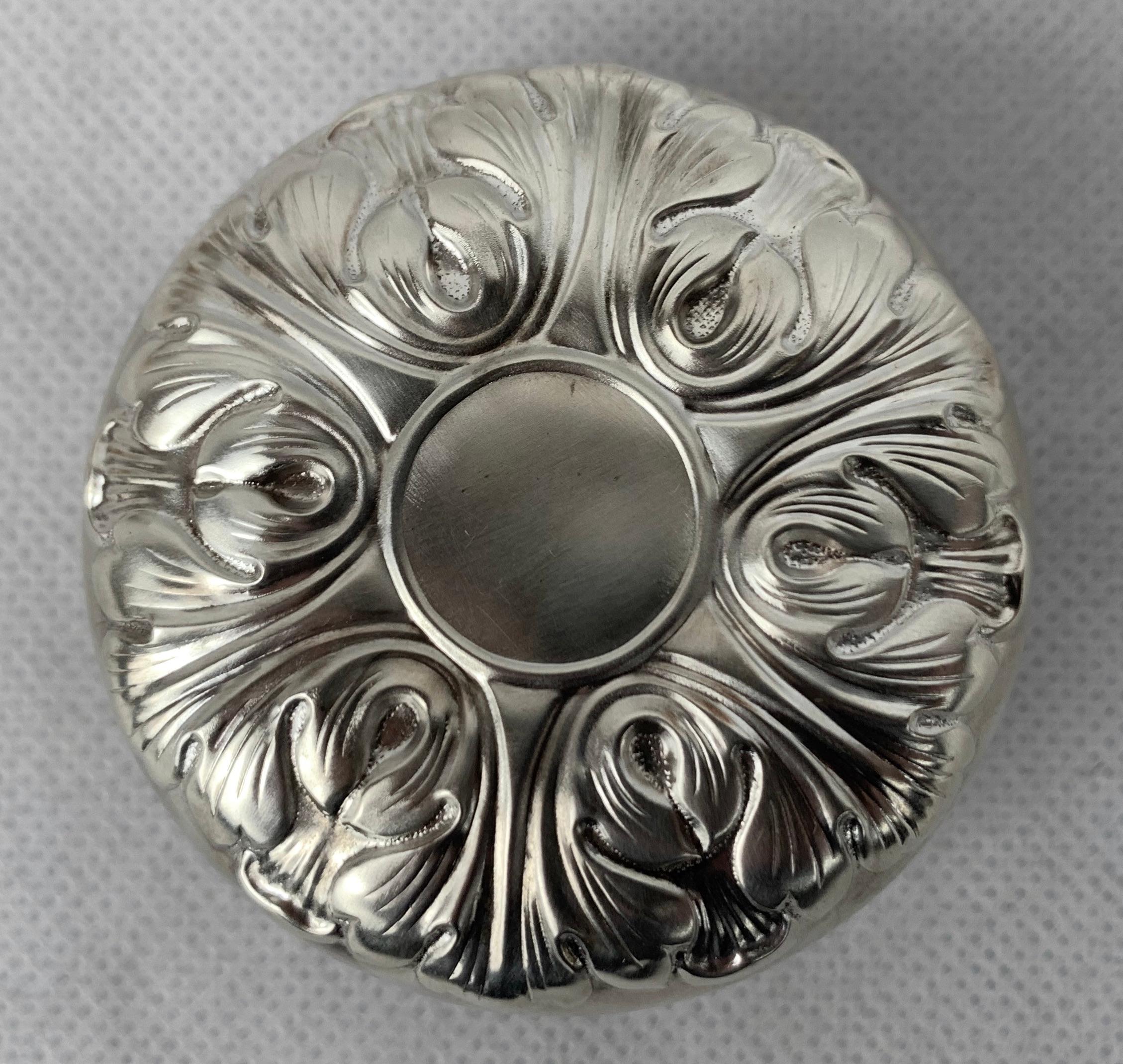 An executive vintage toy in sterling silver repoussé by the Gorham Manufacturing Company of Providence Rhode Island. The design is of acanthus leaves which is a nod to neoclassicism. These were made between the 1950's and 1970's.
The sterling silver